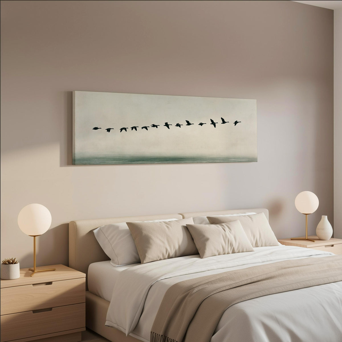 Geese flying over still water wide panoramic canvas print above a bed in a neutral bedroom