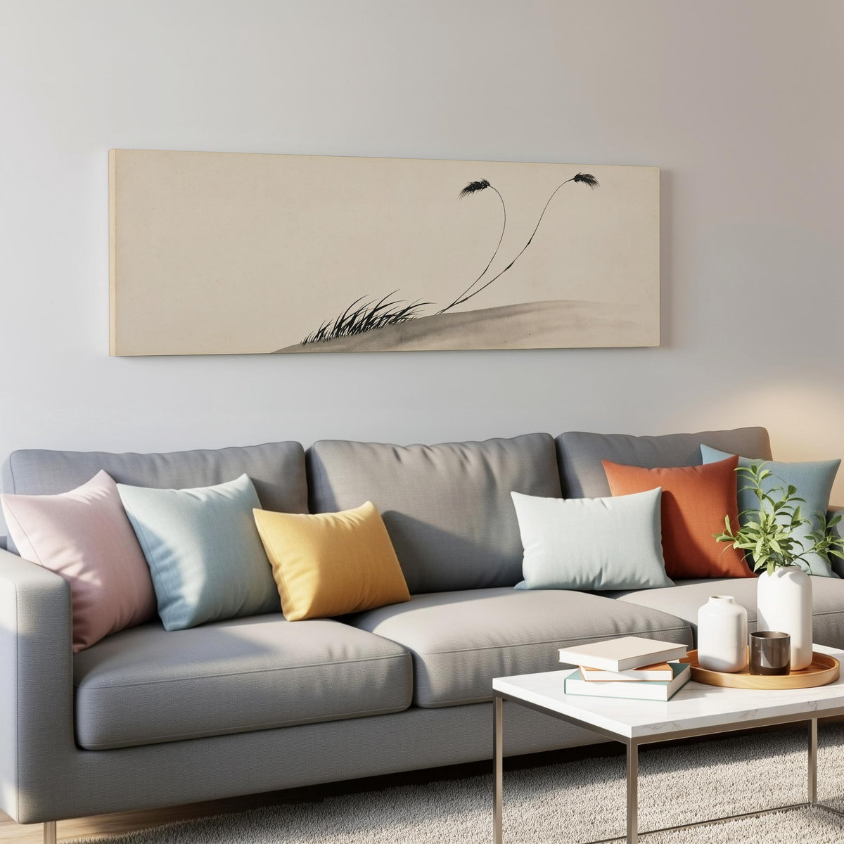 Two birds perched on bending ink reeds panoramic canvas print above a grey sofa in a living room
