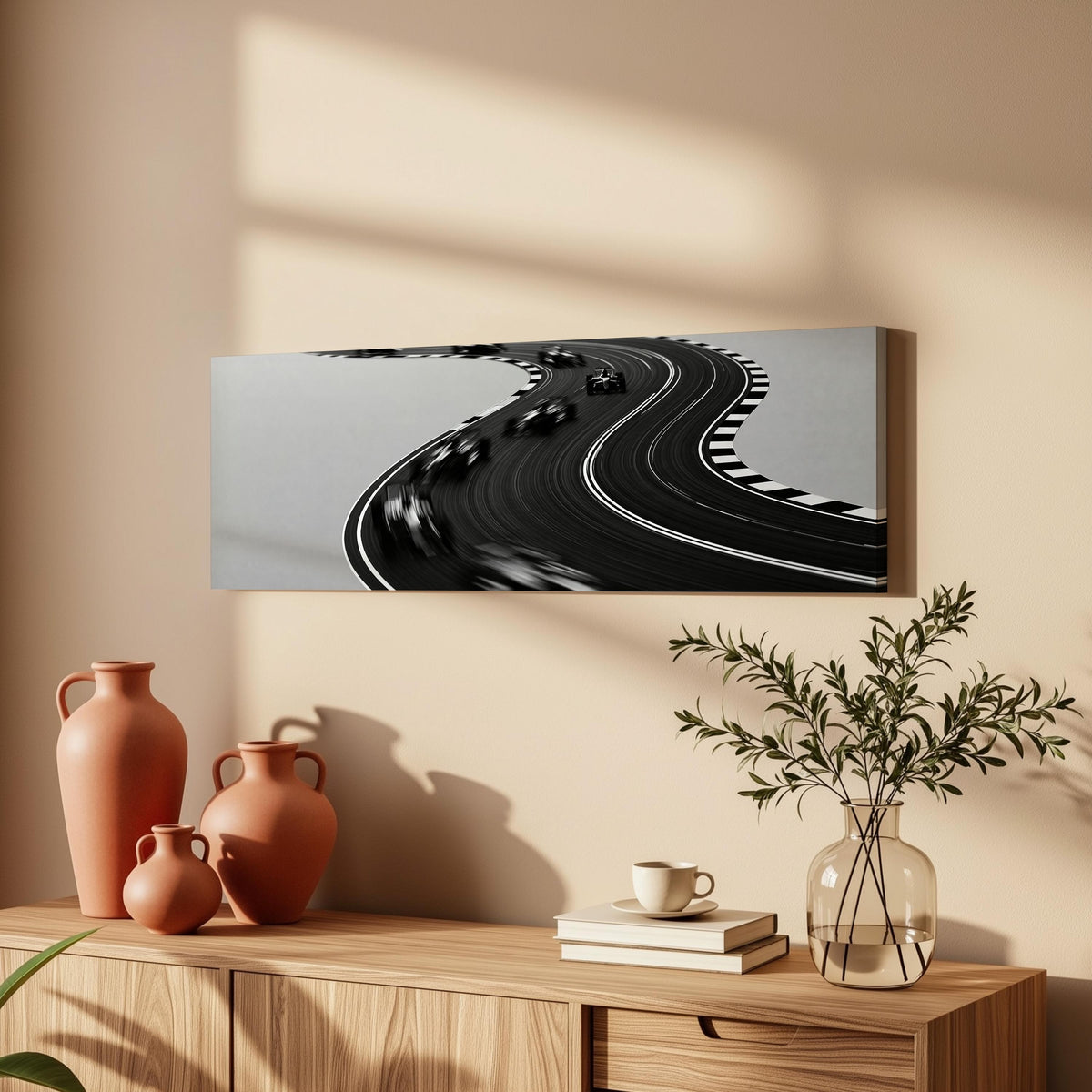 Winding race track in monochrome long horizontal canvas print above a wooden sideboard