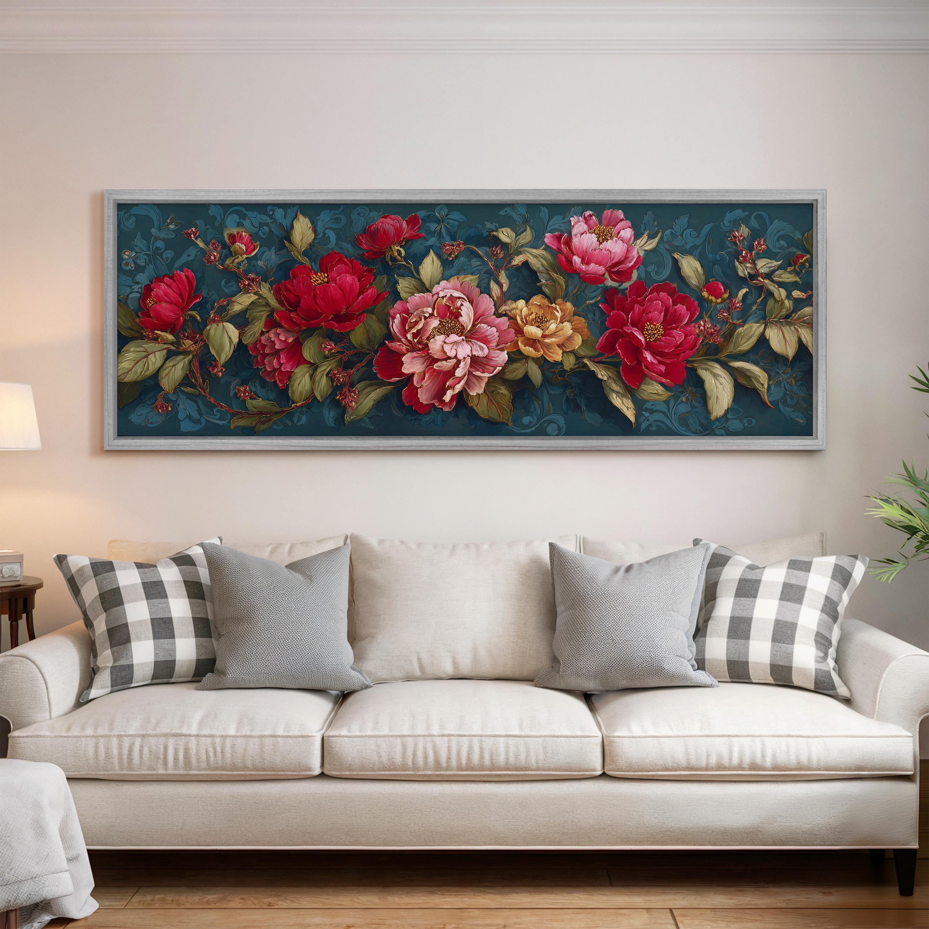 a large, framed painting of a floral arrangement hanging on a wall above a white couch with gray and white plaid throw pillows.