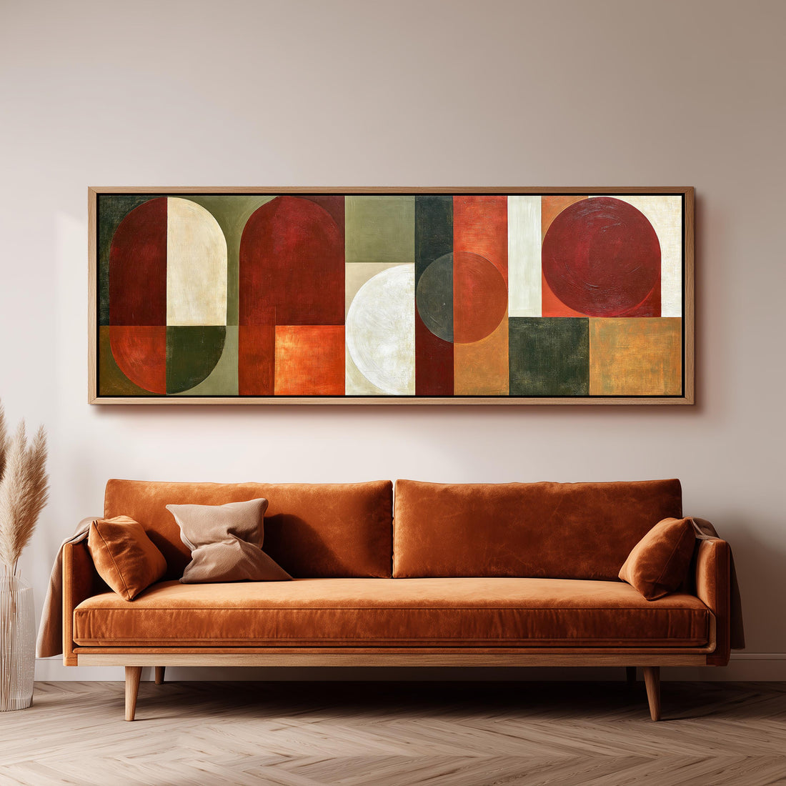 Maroon and olive geometric arches long horizontal canvas print above a sofa in a living room