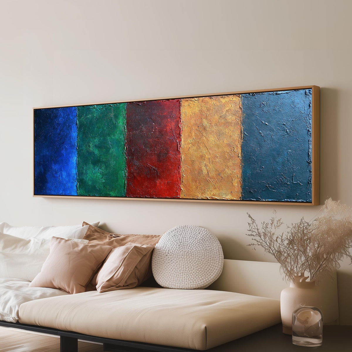Textured jewel tone vertical bands panoramic canvas print above a sofa in a living room