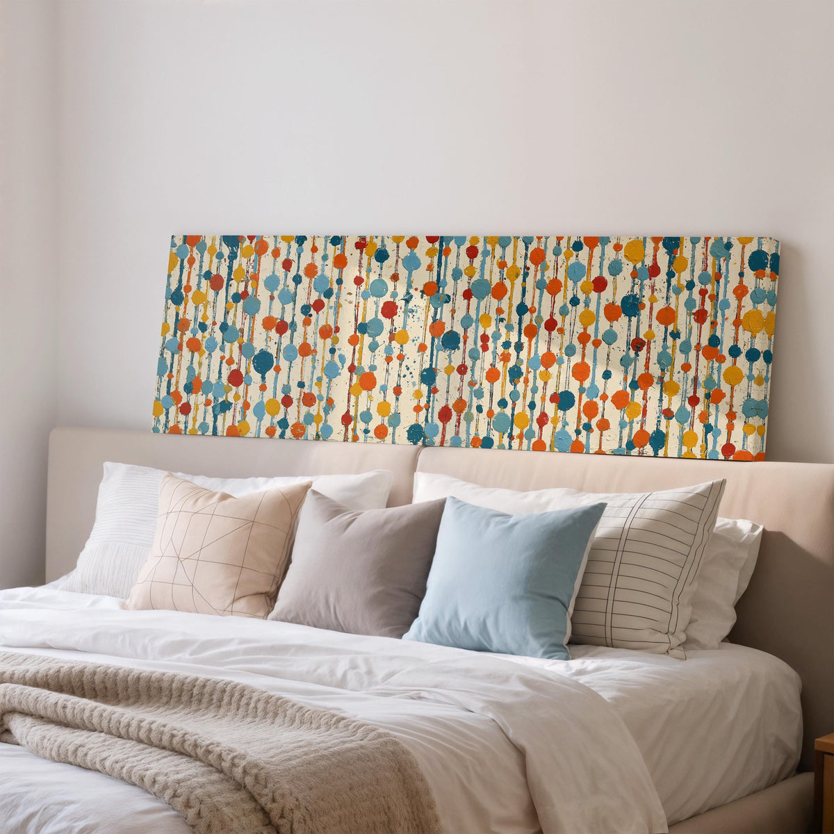 Strings of colorful polka dot blooms wide panoramic canvas print above a bed in a bedroom