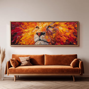 a large, vibrant painting of a lion's face hanging on a wall above a brown sofa.