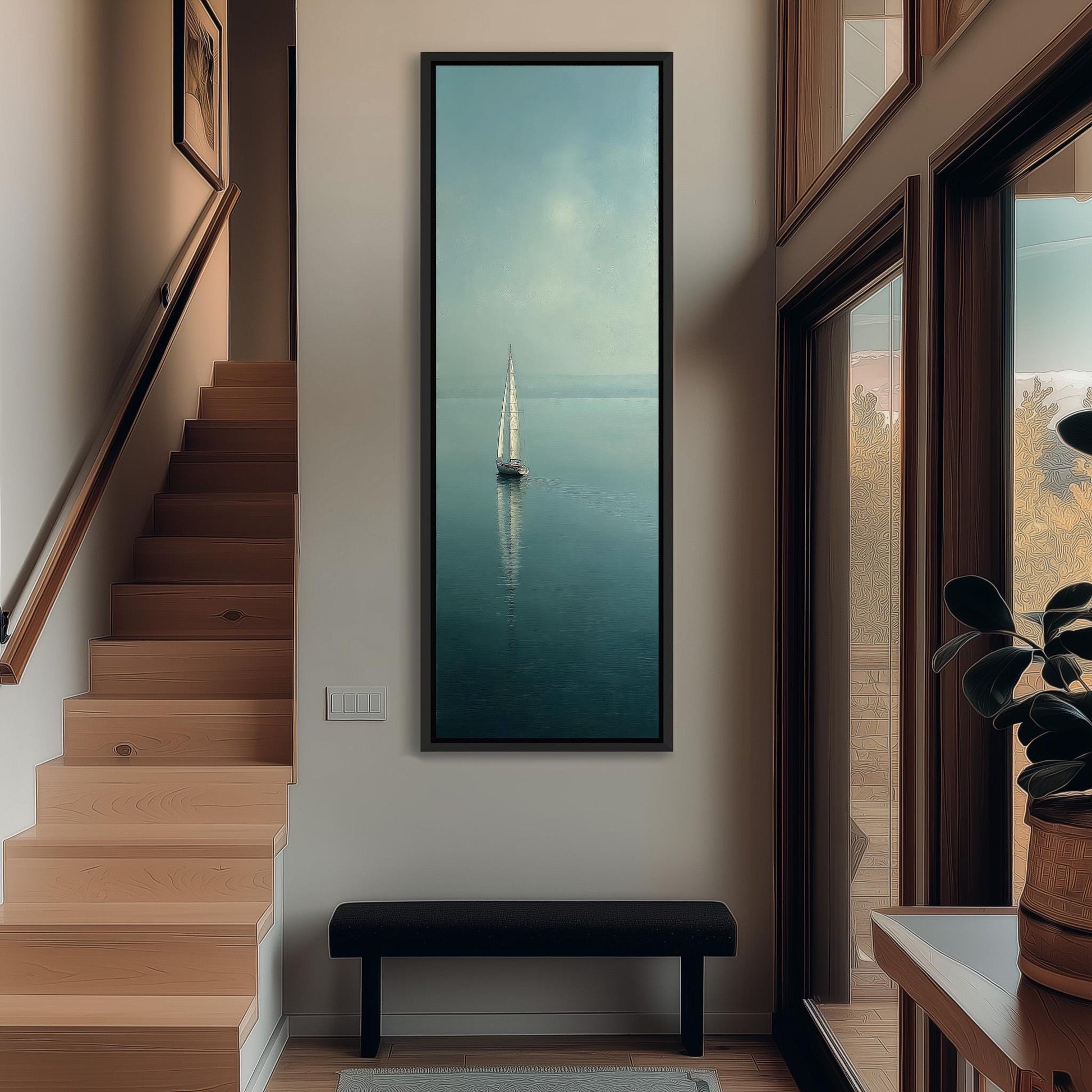a large painting of a sailboat on the ocean, hanging on a wall in a hallway. The painting is framed and appears to be the focal point of the room.