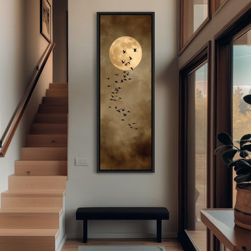 a large painting of a full moon with a flock of birds flying around it, hanging on the wall of a hallway.