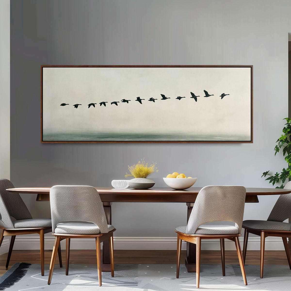 Geese flying over still water long horizontal canvas print above a dining table