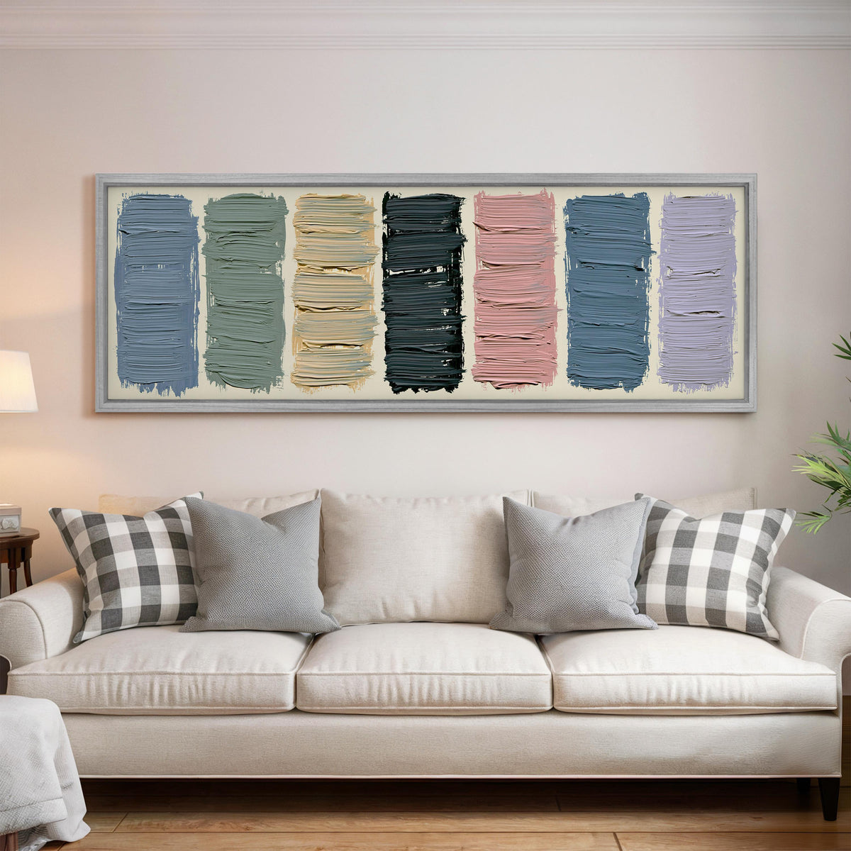 Pastel brushstroke color swatches panoramic canvas print above a white sofa in a bright living room