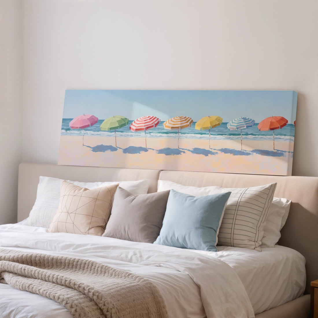 a large beach scene with colorful umbrellas on the sand, creating a relaxing and vacation-like atmosphere.