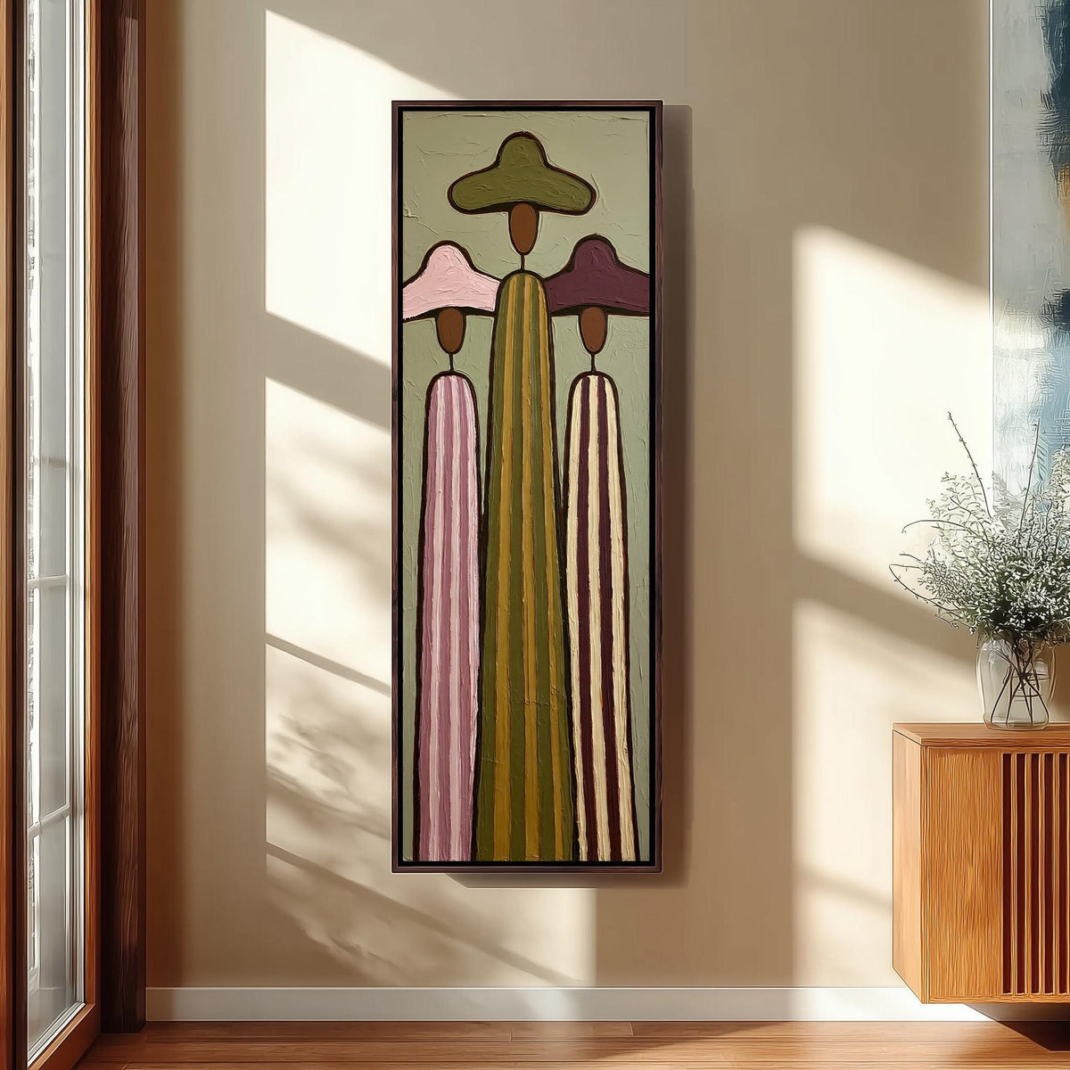 Three tall striped figures in wide hats tall skinny canvas print in a sunlit living space