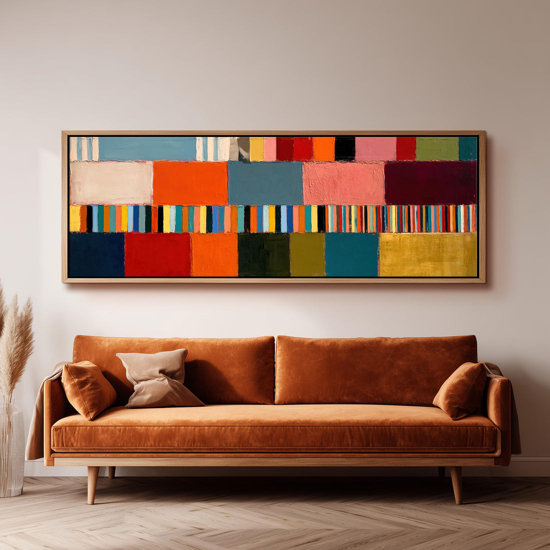 Rainbow patchwork color bands long horizontal canvas print above a sofa in a living room
