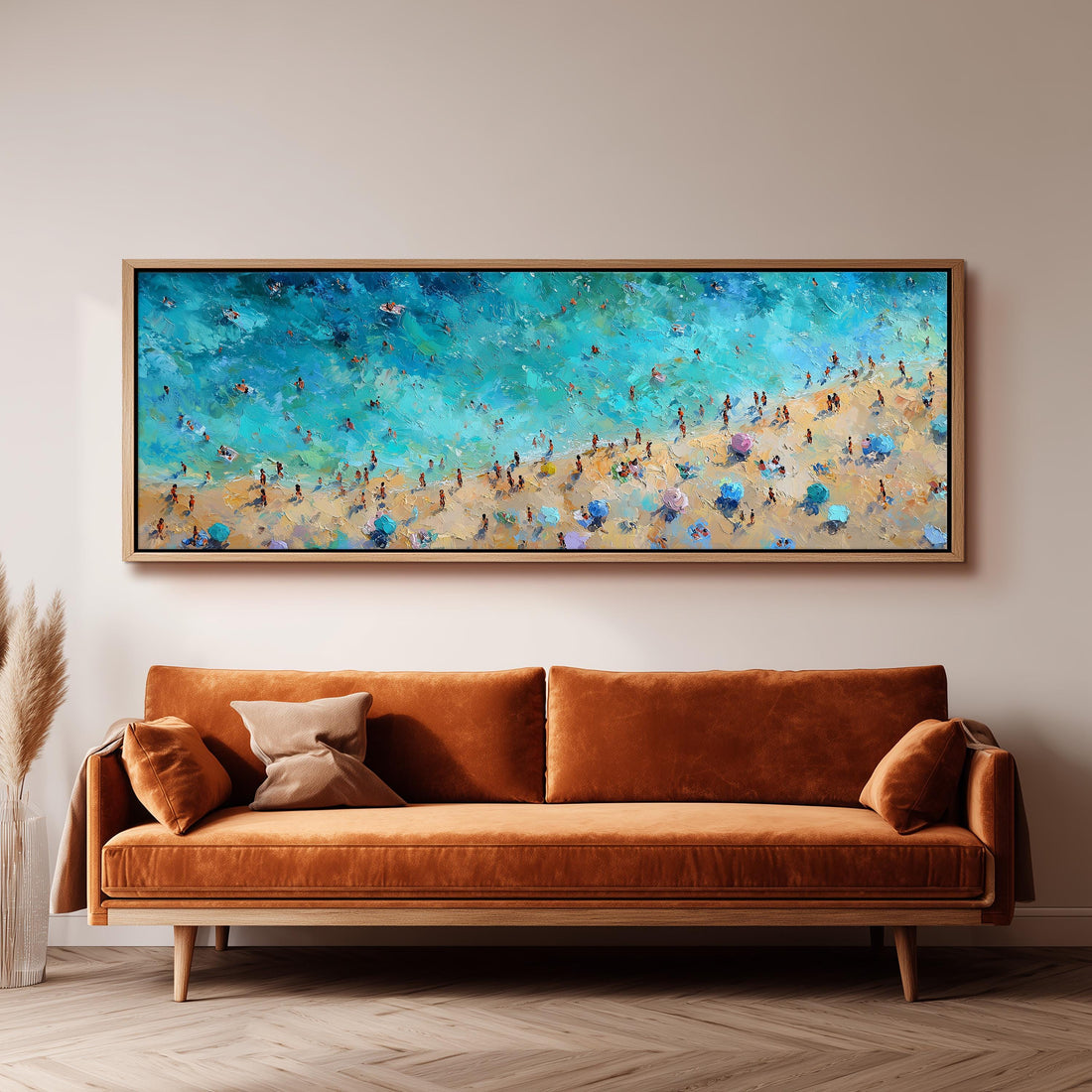 a large, vibrant painting of a beach scene hanging on a wall above a brown sofa.
