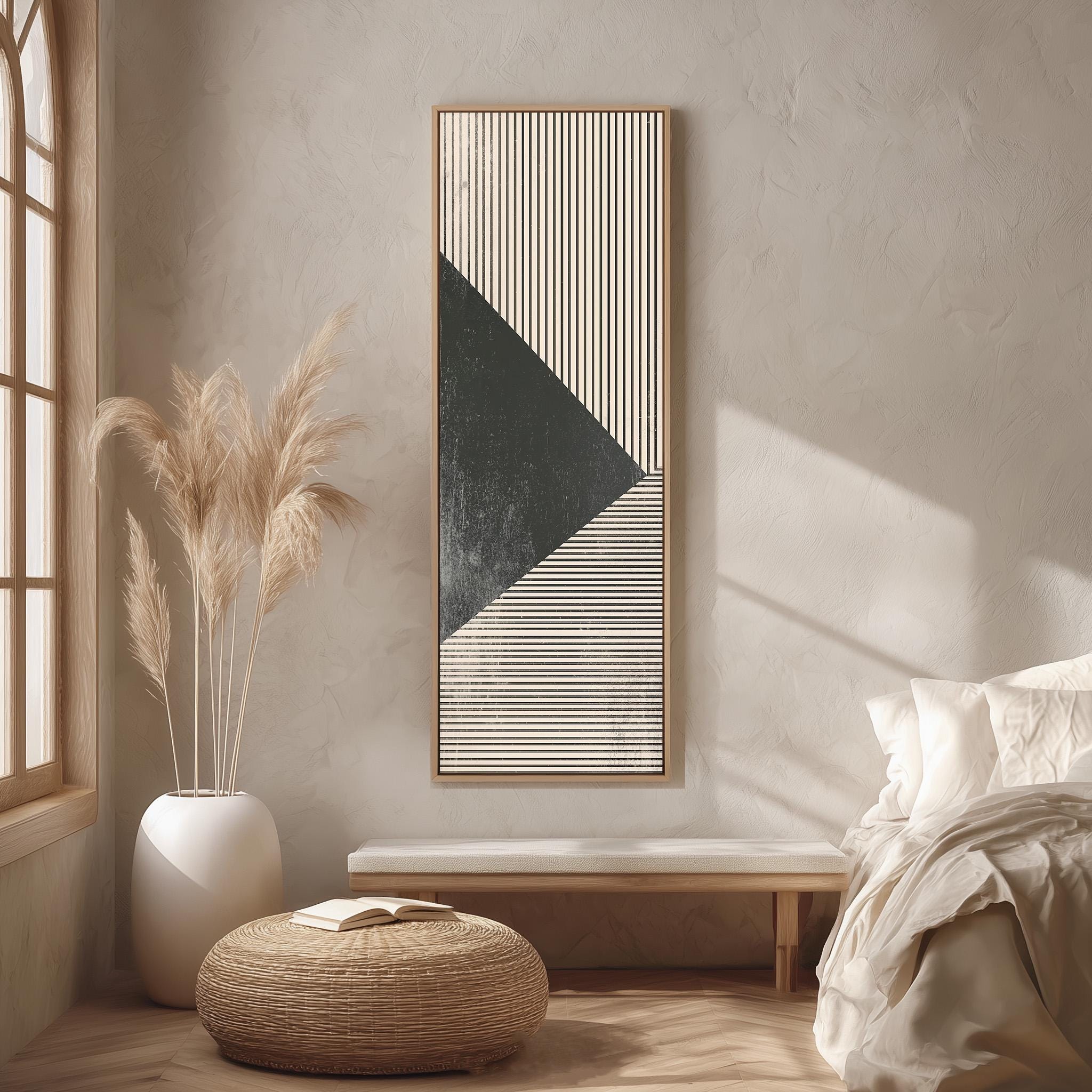 a serene and minimalist bedroom with a large abstract painting on the wall, a white bed with a white pillow, a white wicker ottoman, and a large window with a white curtain.