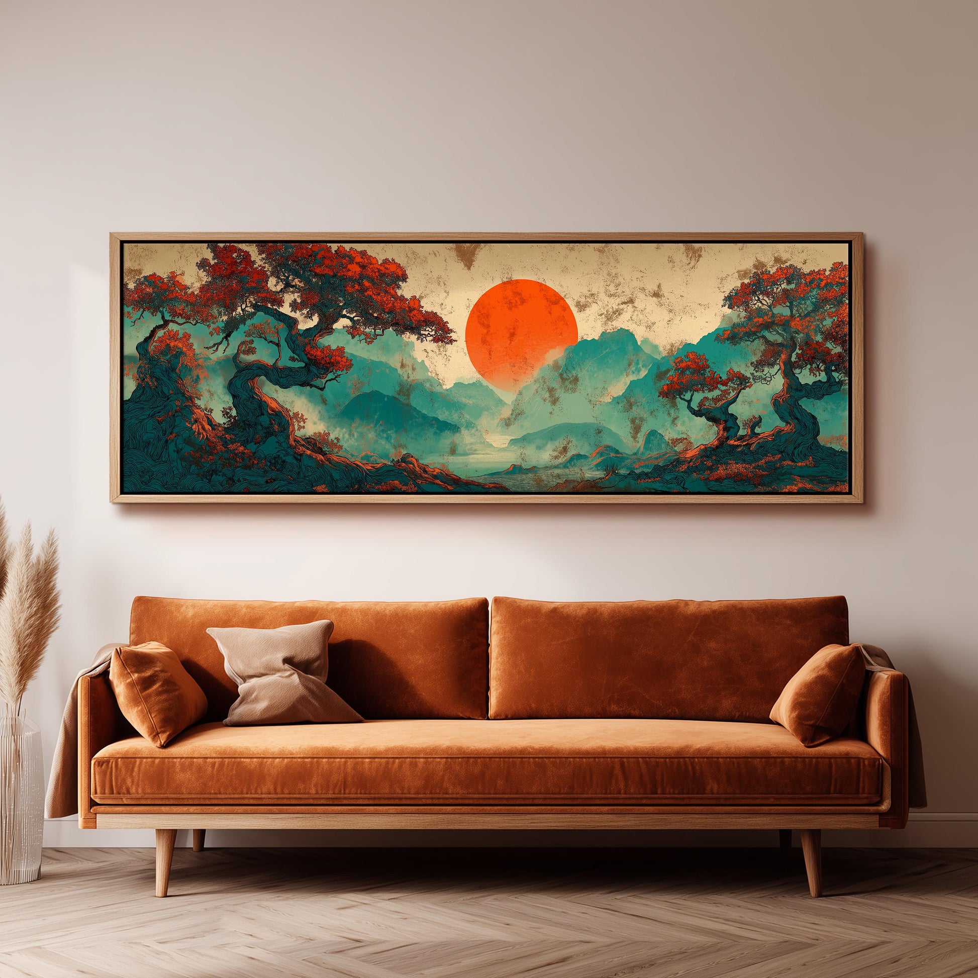 a large, vibrant painting of a landscape with a red sun in the sky, surrounded by trees and mountains. The painting is hanging on a wall above a brown sofa, creating a cozy and artistic atmosphere in the room.