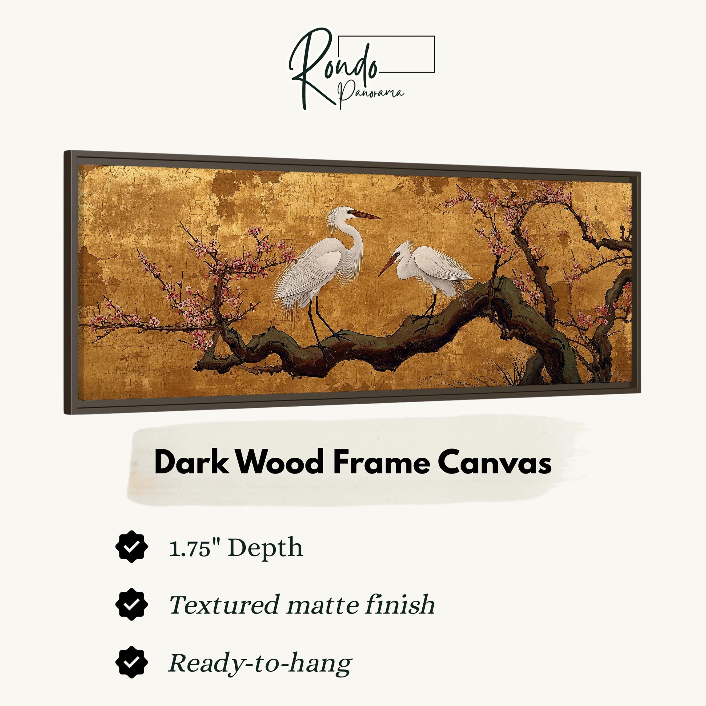 The image is a framed artwork depicting two white birds perched on a branch with pink flowers. The artwork is described as a dark wood frame canvas with a 1.75" depth, a textured matte finish, and is ready to hang.