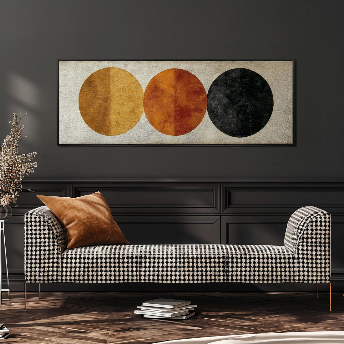 a well-made bed with a variety of pillows and a blanket, and a large abstract painting featuring three circles on the wall above the bed.