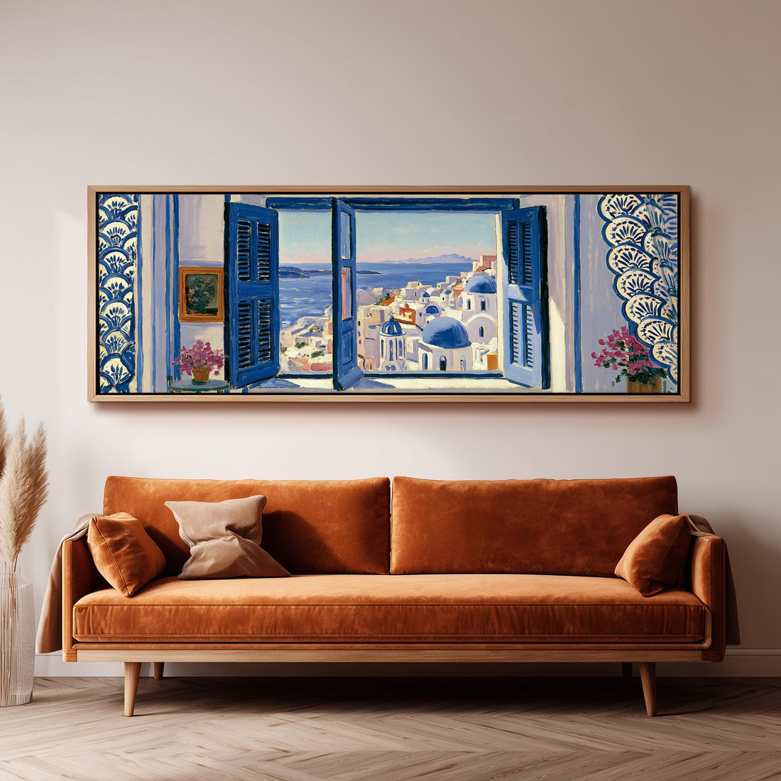 Santorini blue domes seen through a window long horizontal canvas print above a sofa in a living room