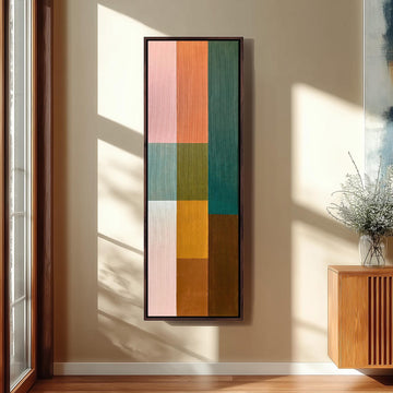 Pastel and earth tone color block grid long vertical canvas print in a sunlit living space
