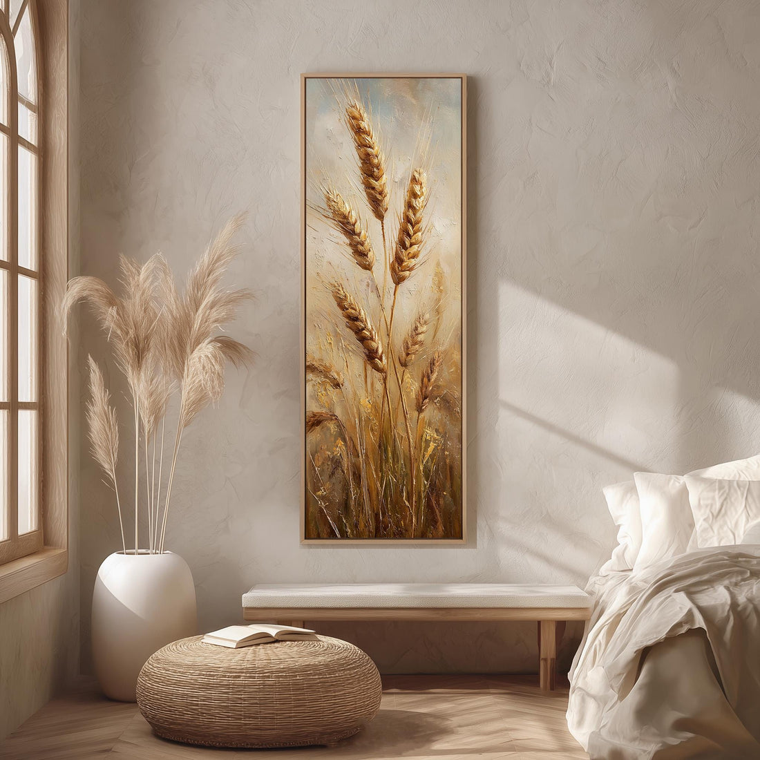 a serene and cozy bedroom scene, featuring a large painting of wheat stalks hanging on the wall, a white bed with a white pillow, a white vase with tall potted plants, and a woven ottoman in front of the bed.