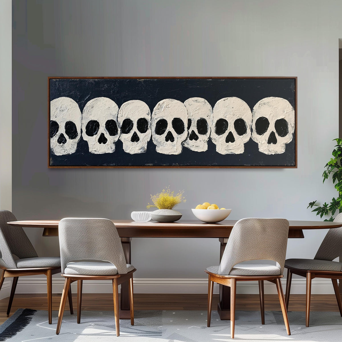 Row of white skulls on navy long horizontal canvas print above a dining table