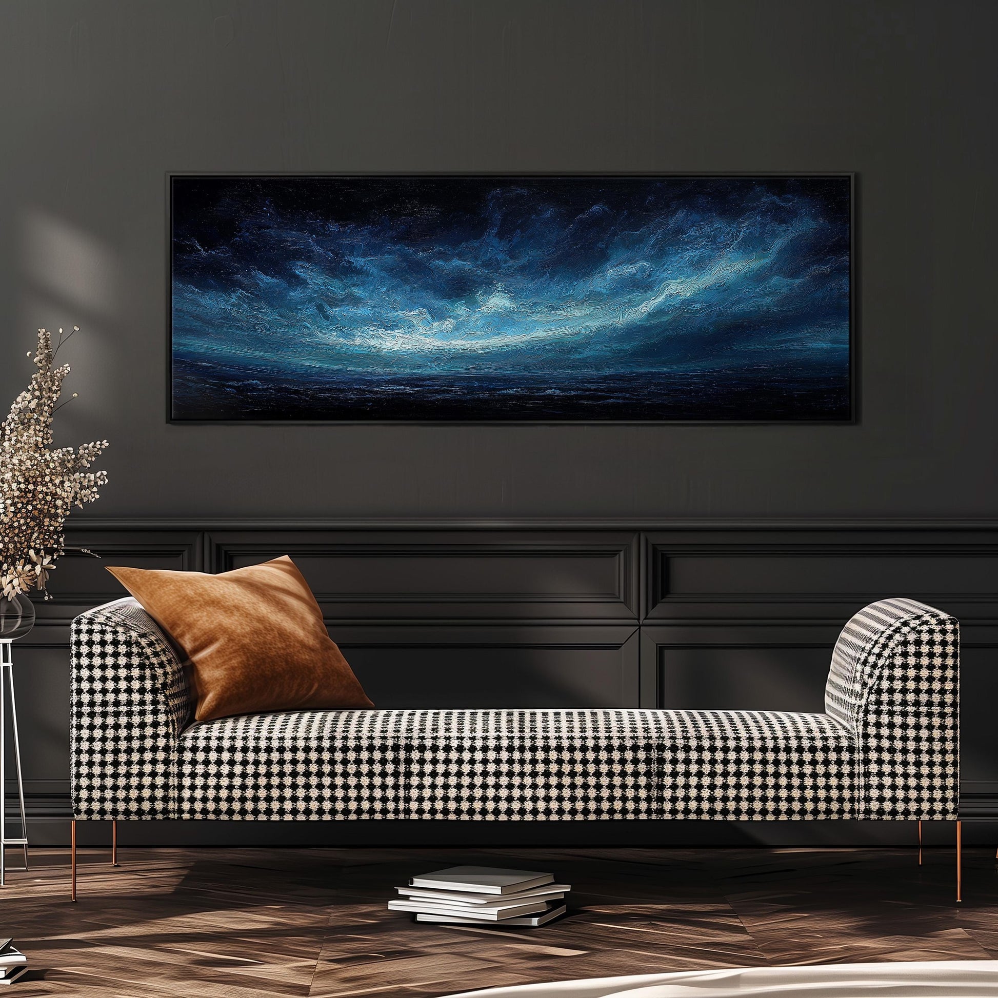 a black and white checkered sofa with a brown throw pillow, positioned in front of a large black and white wall art depicting a night sky with clouds.