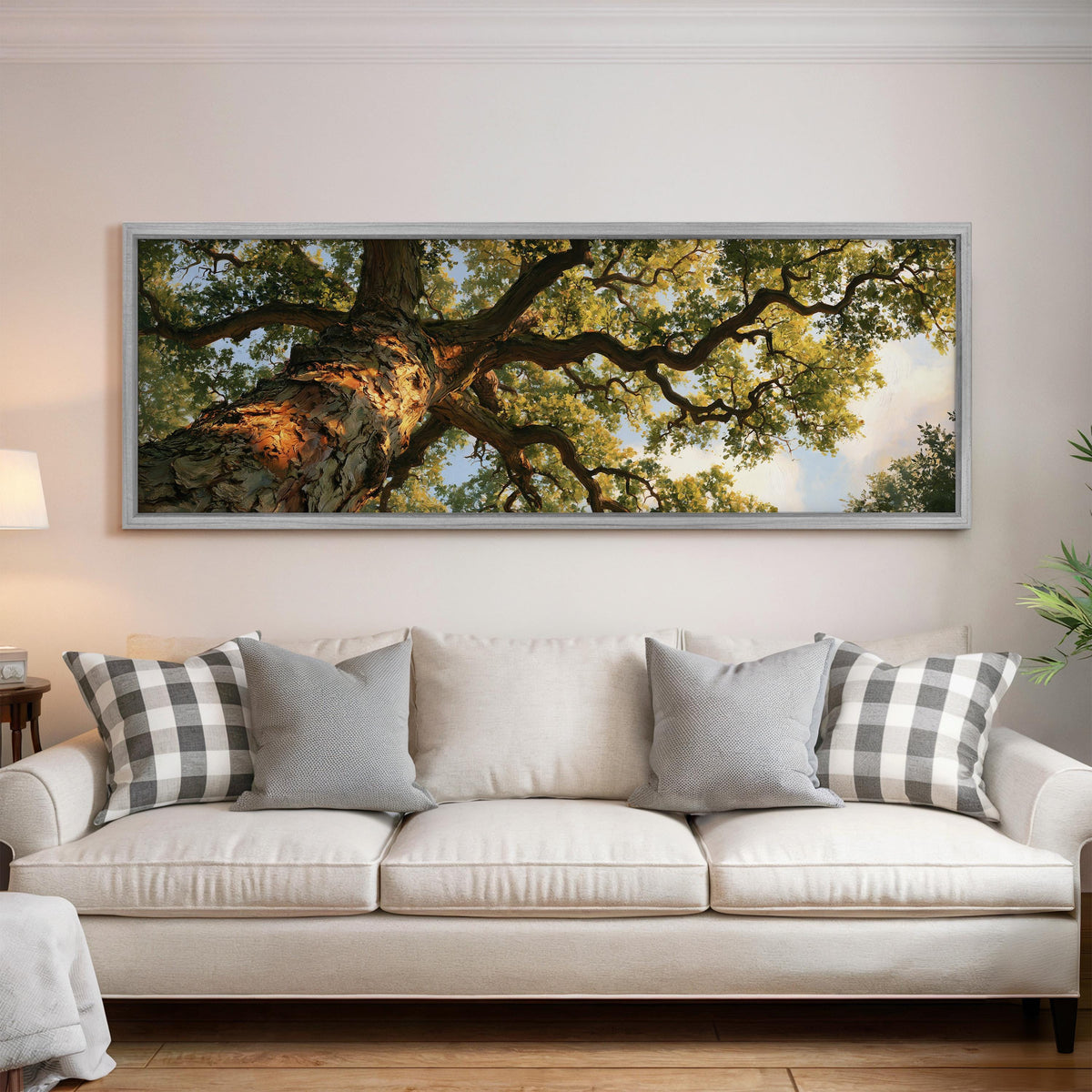 Twisting oak branch from below long horizontal canvas print displayed on a wall