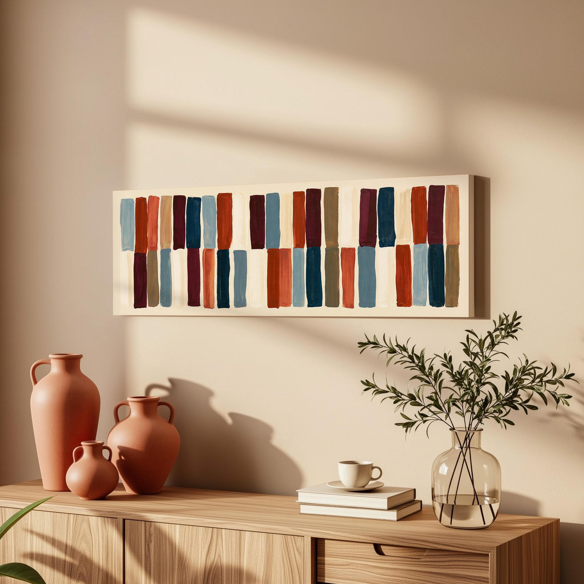 Two tiers of staggered stripe blocks long horizontal canvas print above a wooden sideboard