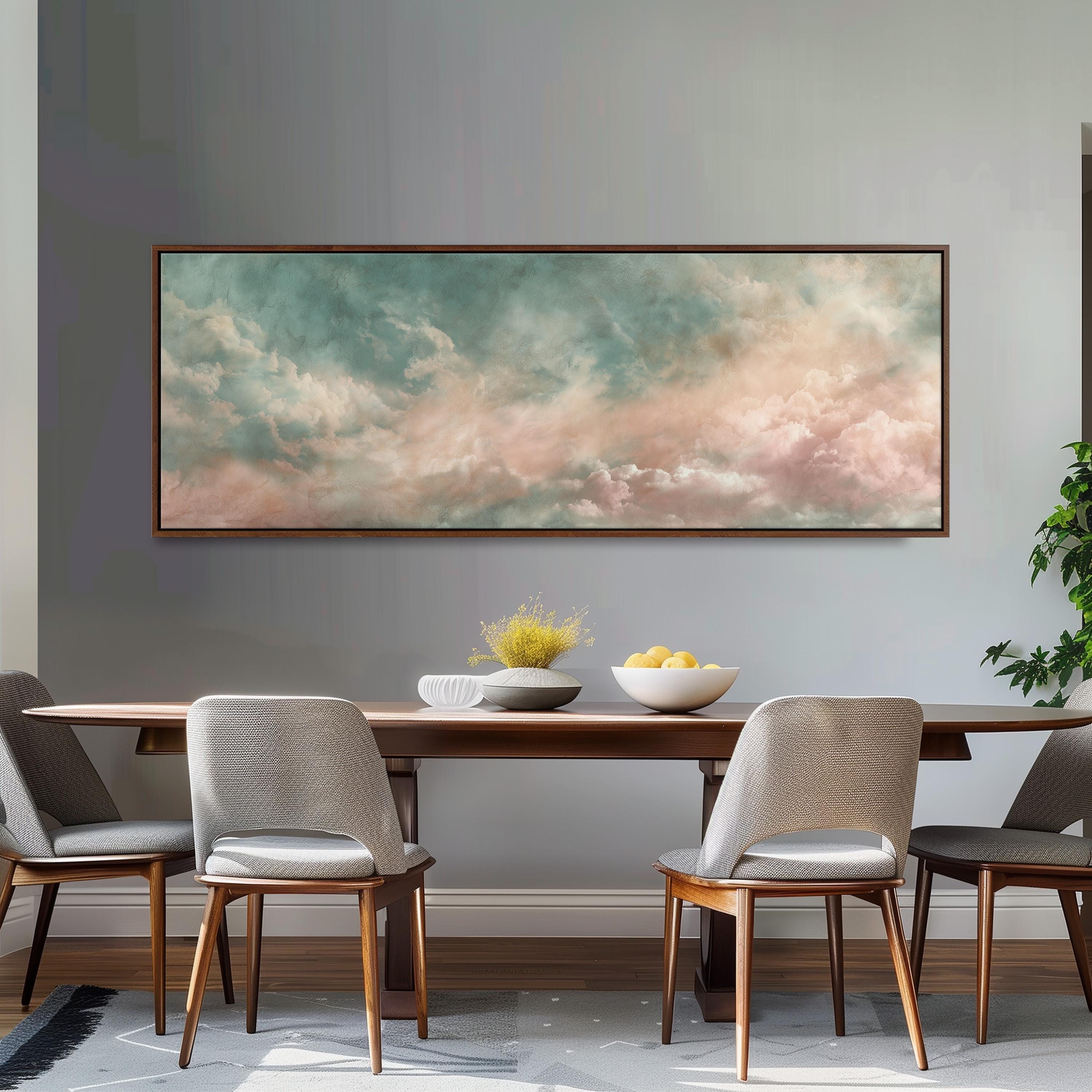 a dining room with a large painting of a cloudy sky hanging on the wall above a wooden dining table with four chairs. The table is set with a bowl of fruit and a vase of flowers, creating a cozy and inviting atmosphere.