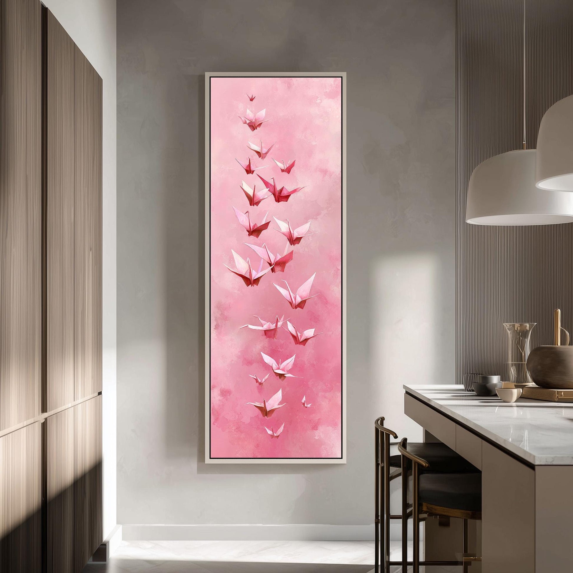 a large, framed painting of pink origami birds hanging on a wall in a modern kitchen.