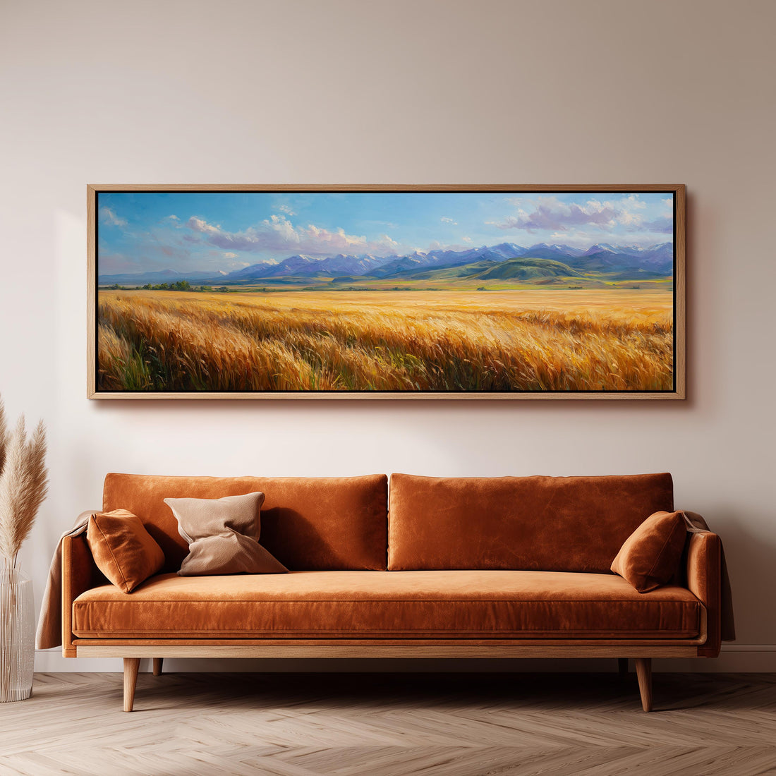 a dining room with a large painting of a field of golden wheat hanging on the wall above a wooden dining table with four chairs. The table is set with a bowl of fruit and a vase of flowers, creating a cozy and inviting atmosphere.
