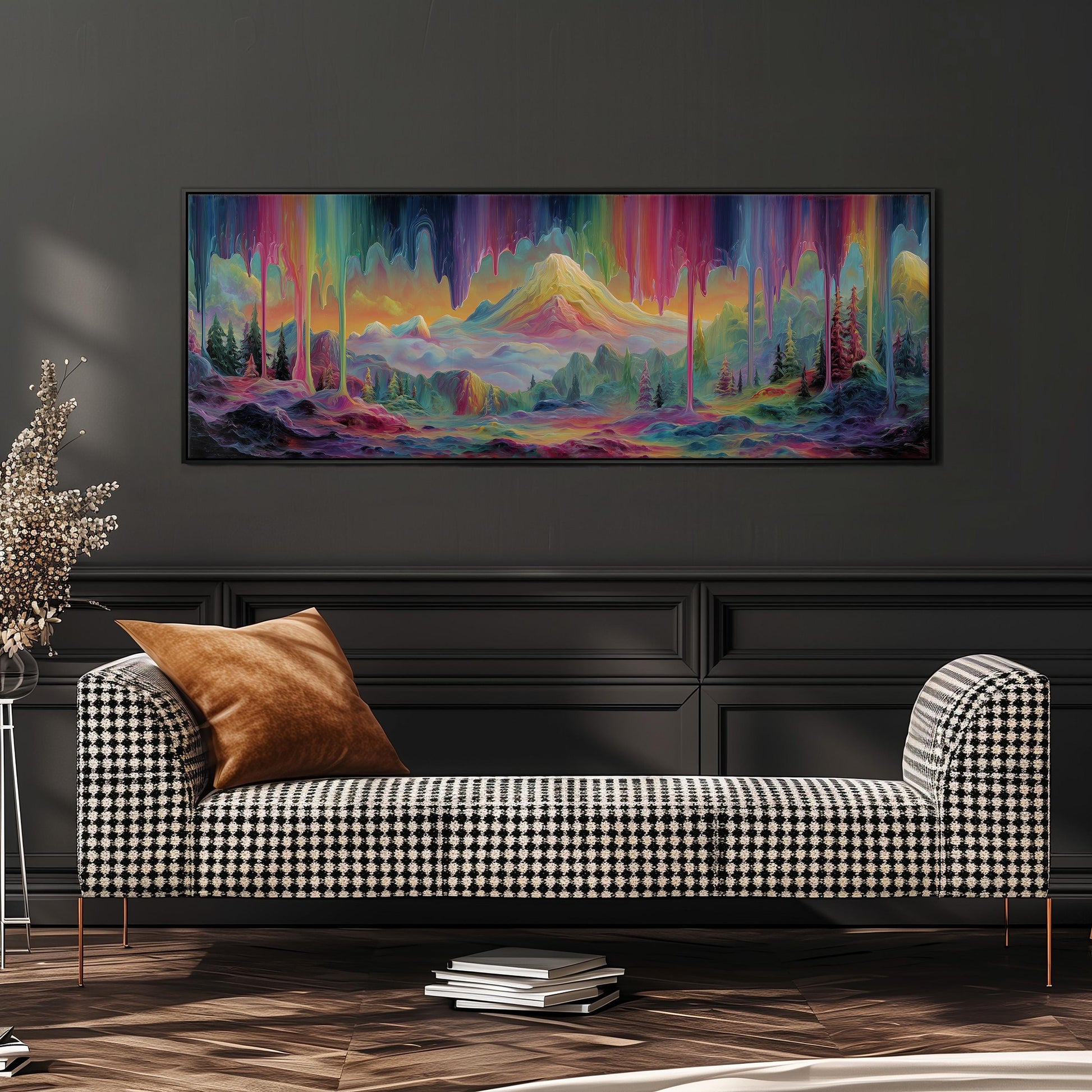 a large, colorful painting of a mountainous landscape hanging on a wall above a black and white checkered sofa.