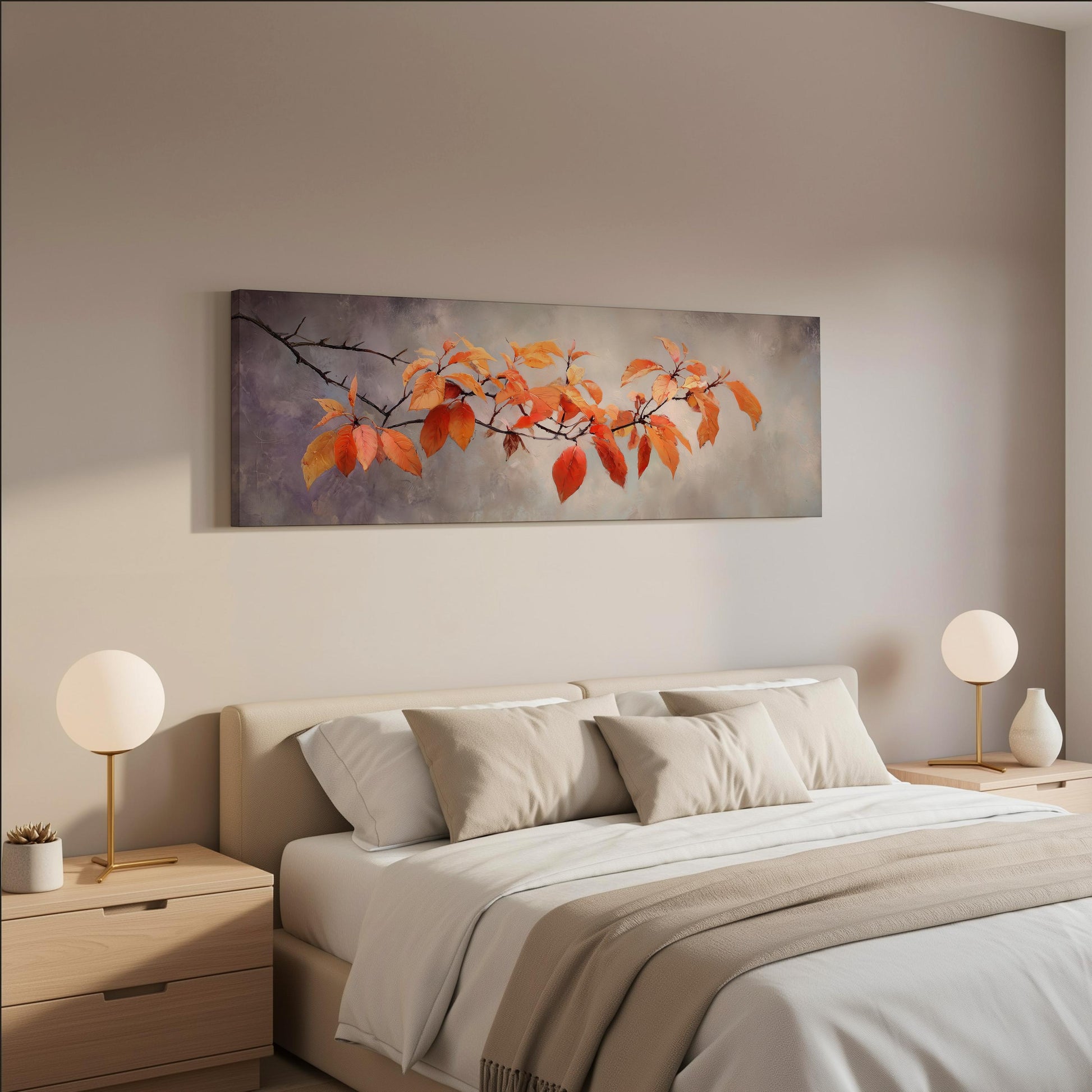 a serene bedroom scene with a large bed adorned with white linens and beige throw pillows. Above the bed, a painting of orange leaves is displayed on the wall, adding a touch of nature to the room. Two white lamps flank the bed, providing a soft, warm lighting. The overall color scheme of the room is neutral, with the orange leaves and white accents creating a harmonious and inviting atmosphere.