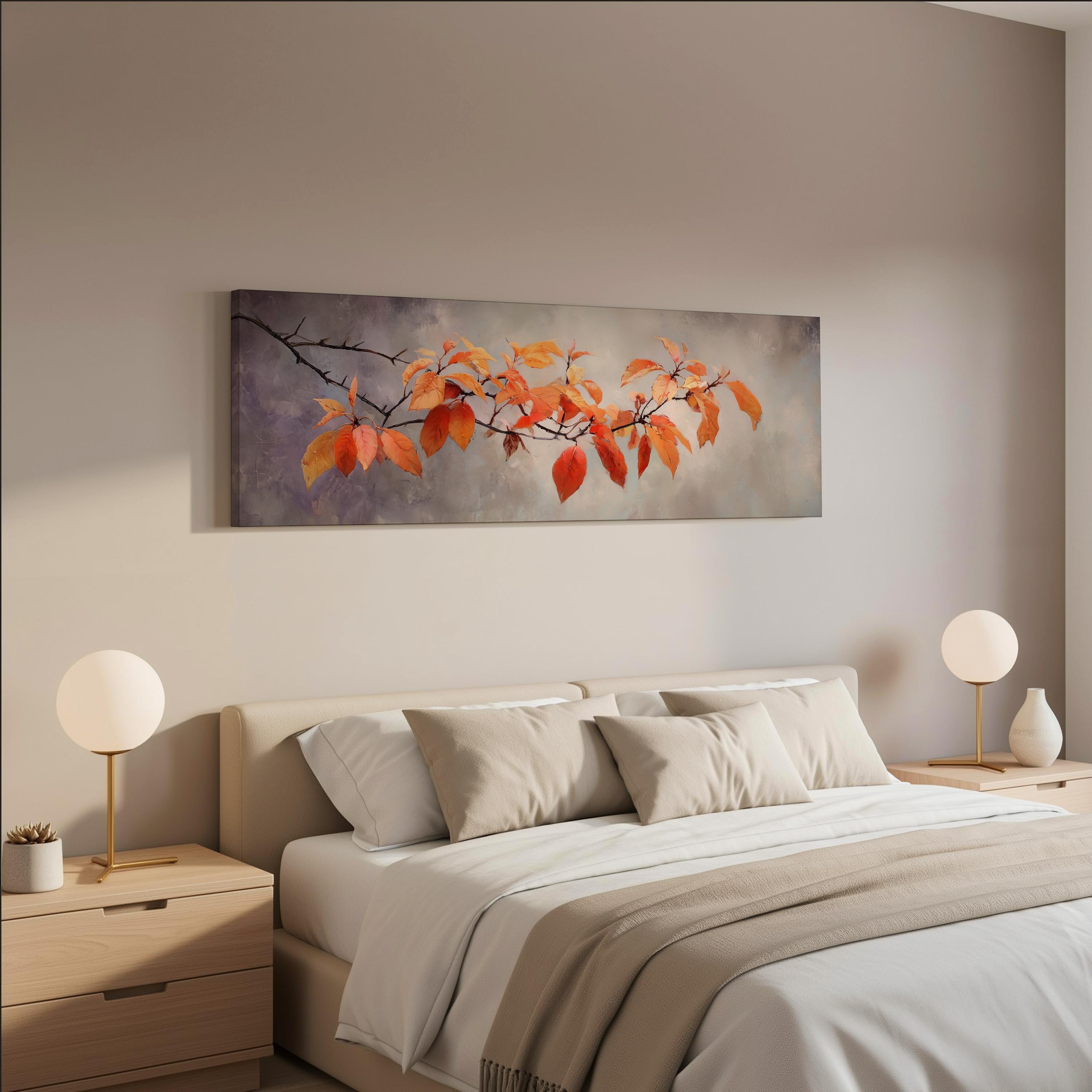 a serene bedroom scene with a large bed adorned with white linens and beige throw pillows. Above the bed, a painting of orange leaves is displayed on the wall, adding a touch of nature to the room. Two white lamps flank the bed, providing a soft, warm lighting. The overall color scheme of the room is neutral, with the orange leaves and white accents creating a harmonious and inviting atmosphere.