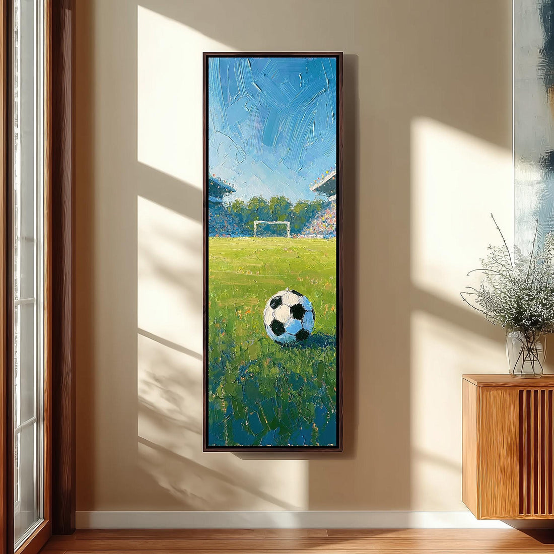 Soccer ball on a stadium pitch long vertical canvas print in a sunlit living space