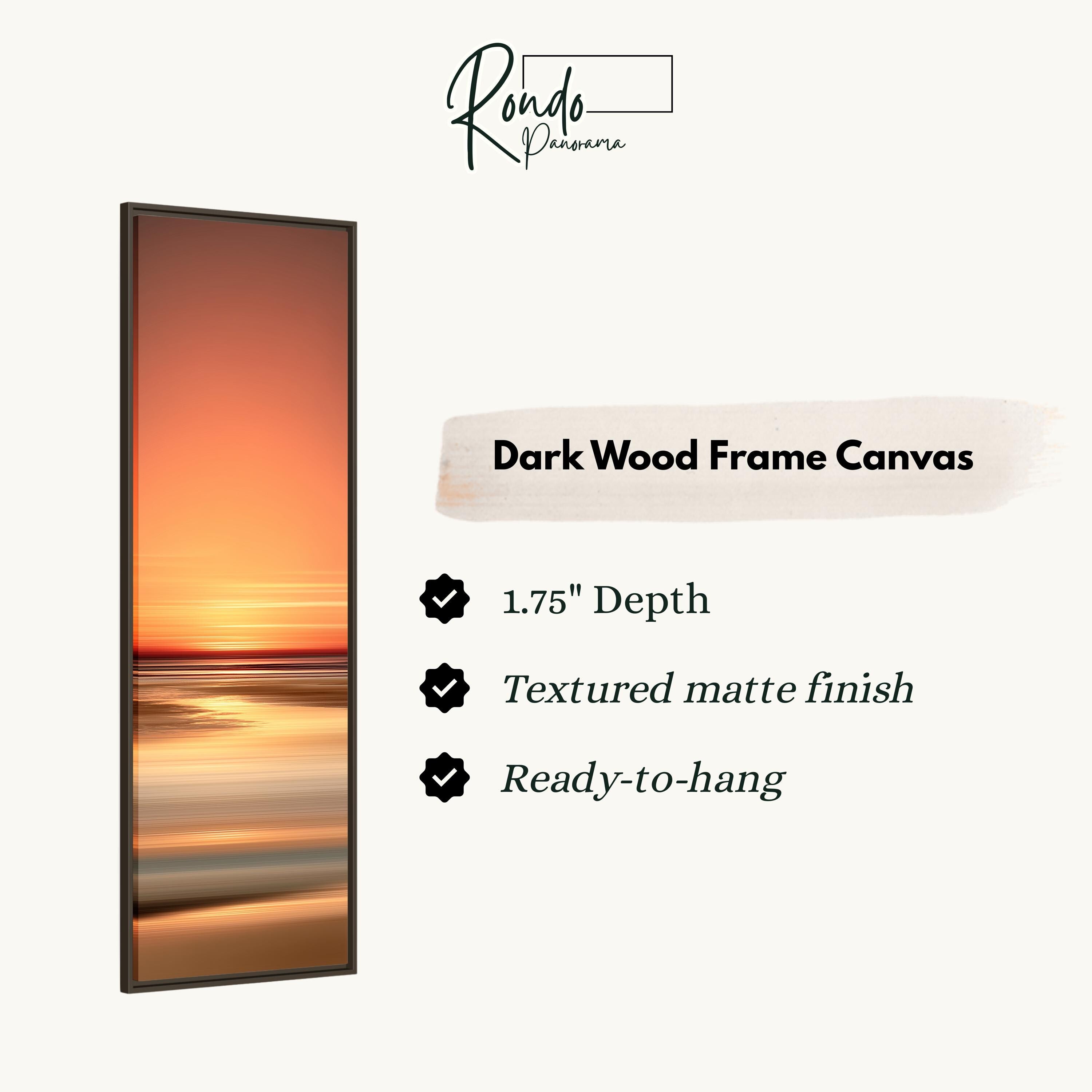 The image is a dark wood frame canvas featuring a sunset over a body of water.