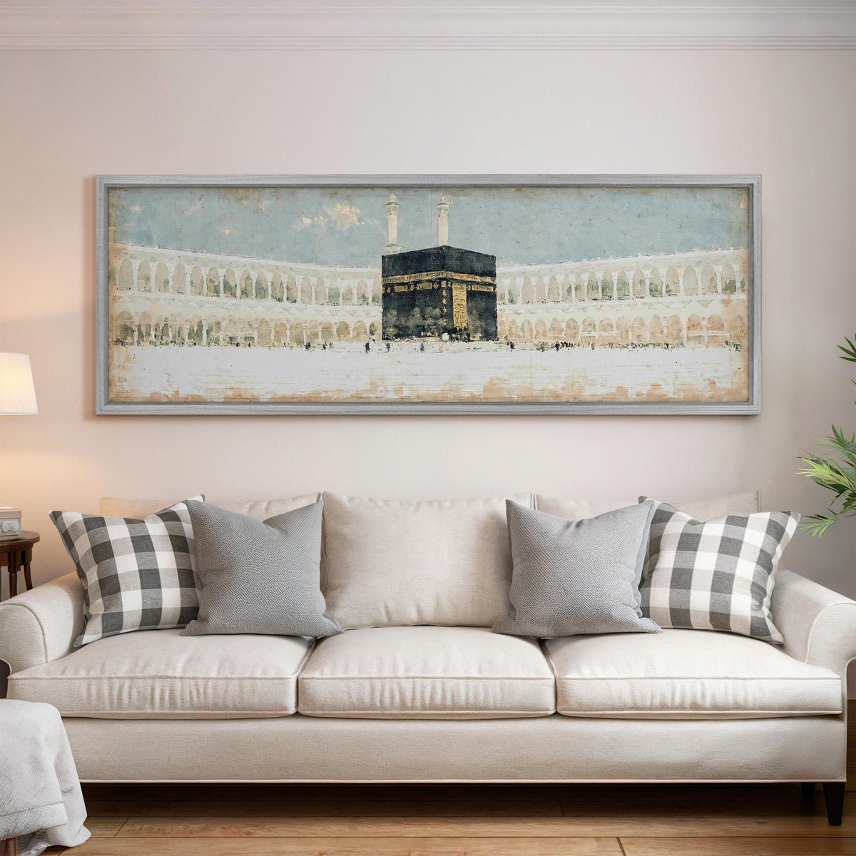 The Kaaba in the Grand Mosque courtyard panoramic canvas print above a white sofa in a bright living room