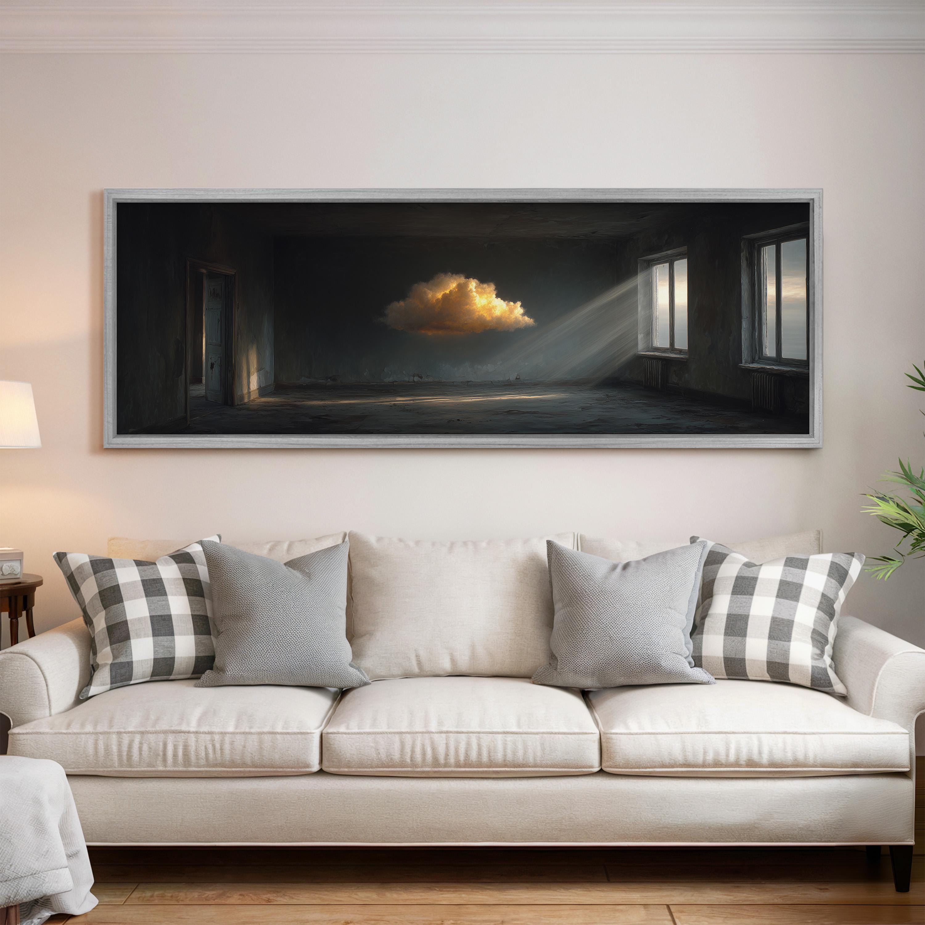 a large, framed painting of a cloud in the sky hanging on a wall above a white couch with gray and white patterned pillows.