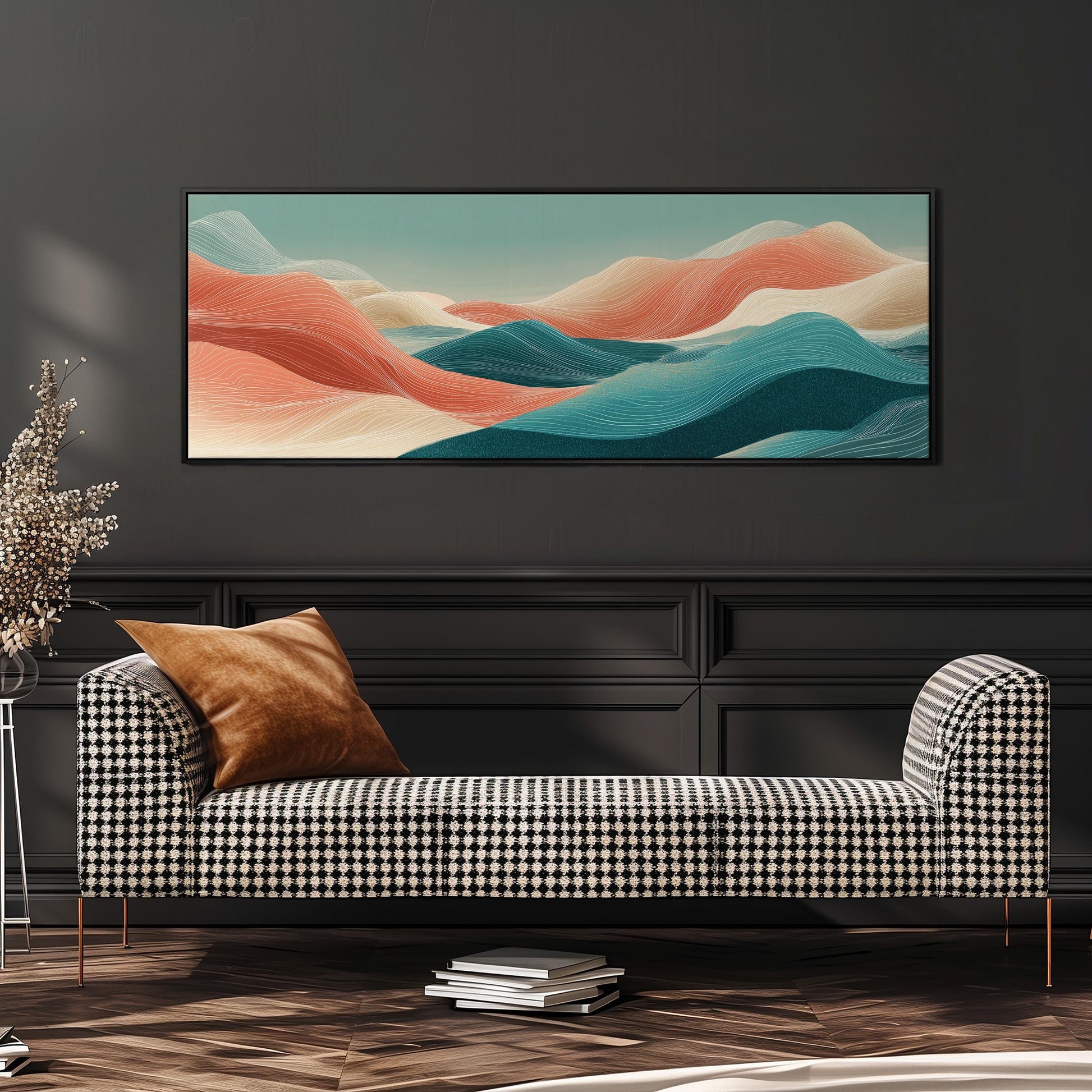 a modern living room with a black and white checkered sofa, a stack of books, and a large abstract landscape painting hanging on the wall above the sofa.