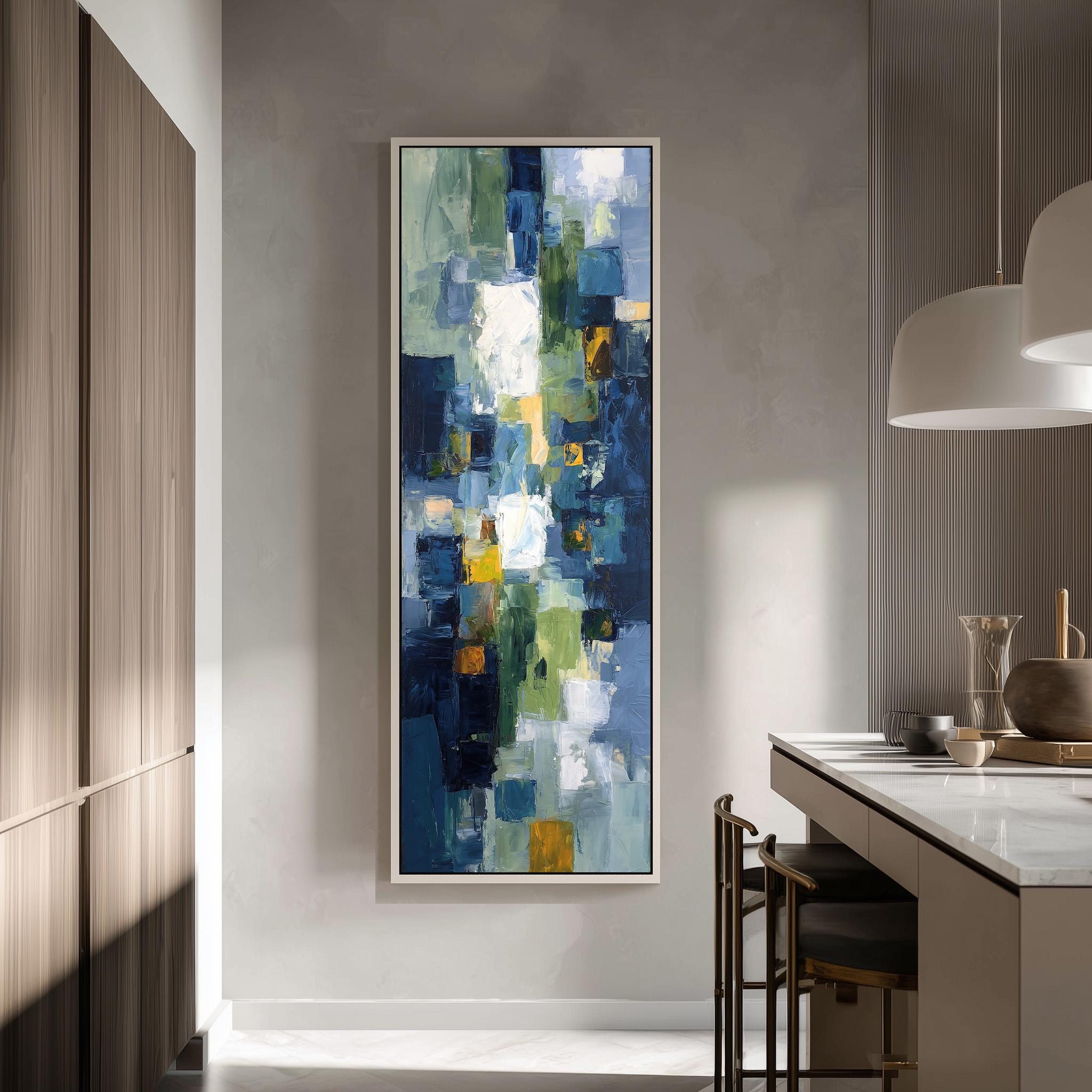 a large abstract painting hanging on a wall in a modern kitchen.