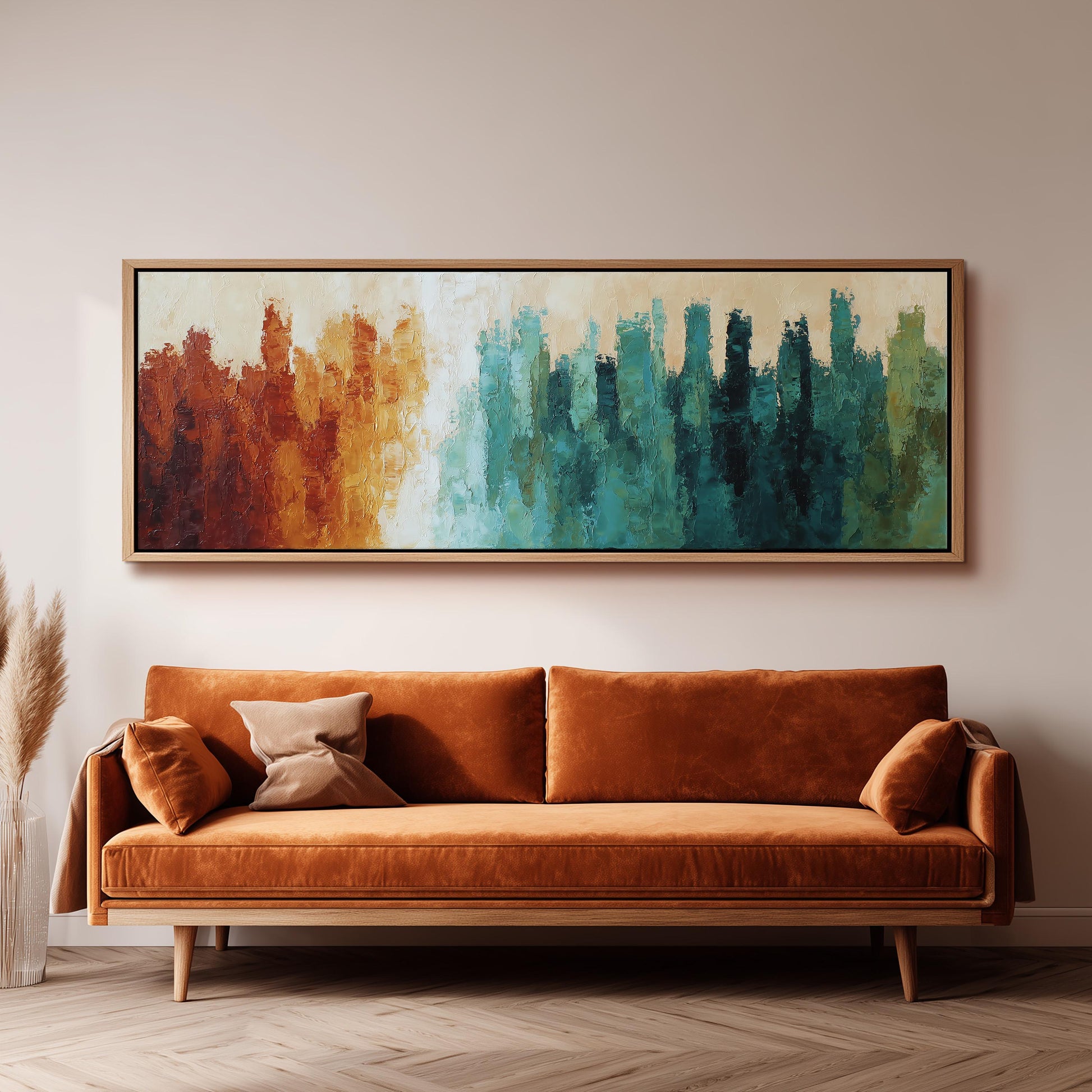 a large, abstract painting hanging on a wall above a brown sofa with orange cushions.