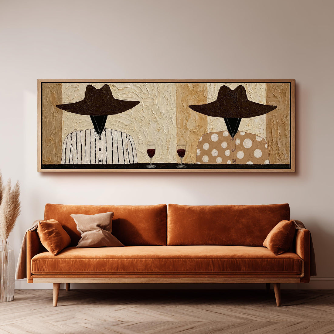 Two folk figures in hats toasting with red wine long horizontal canvas print above a sofa in a living room