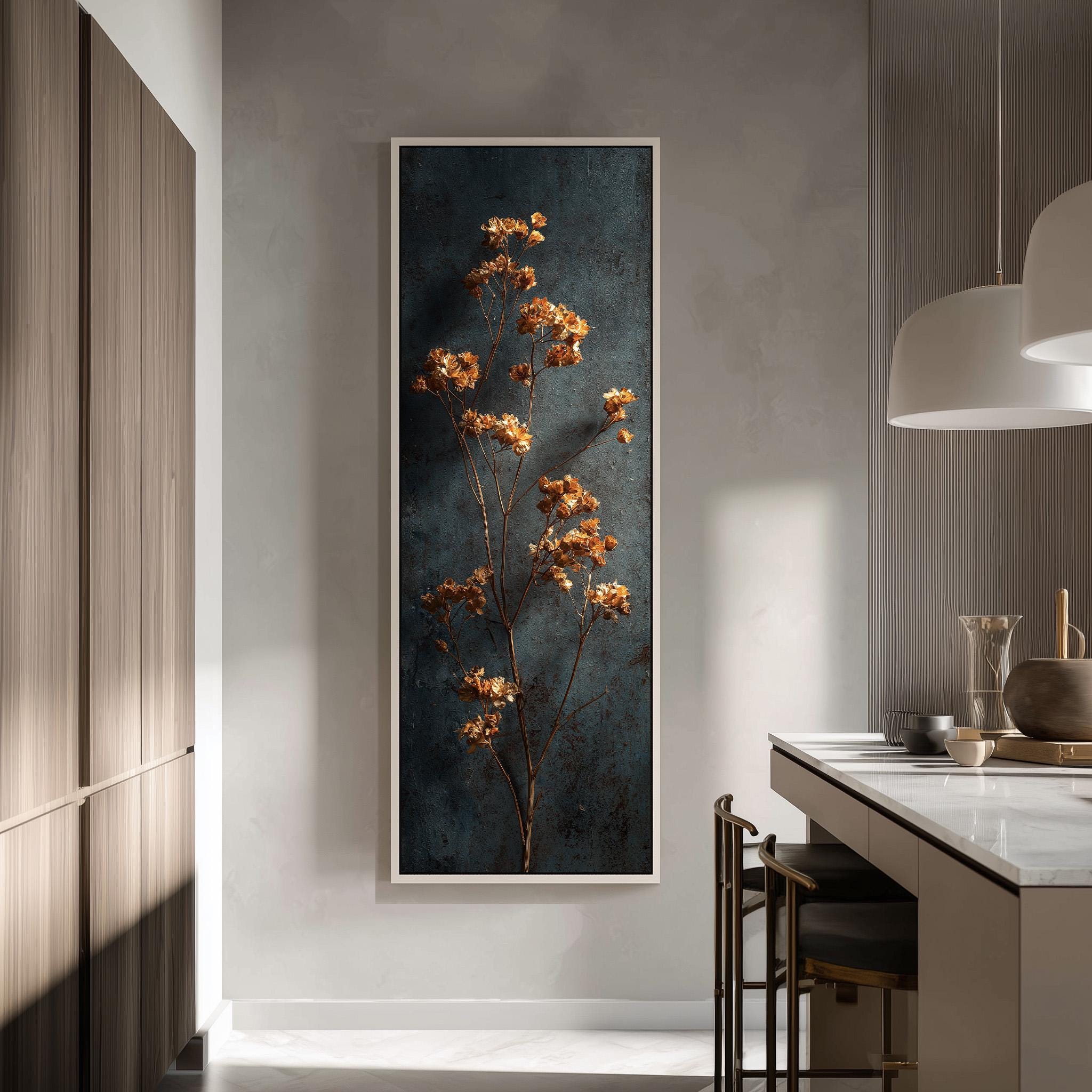 a modern kitchen with a large framed artwork of a tree with orange flowers hanging on the wall. The kitchen has a white countertop and a wooden cabinet, creating a clean and minimalist aesthetic.