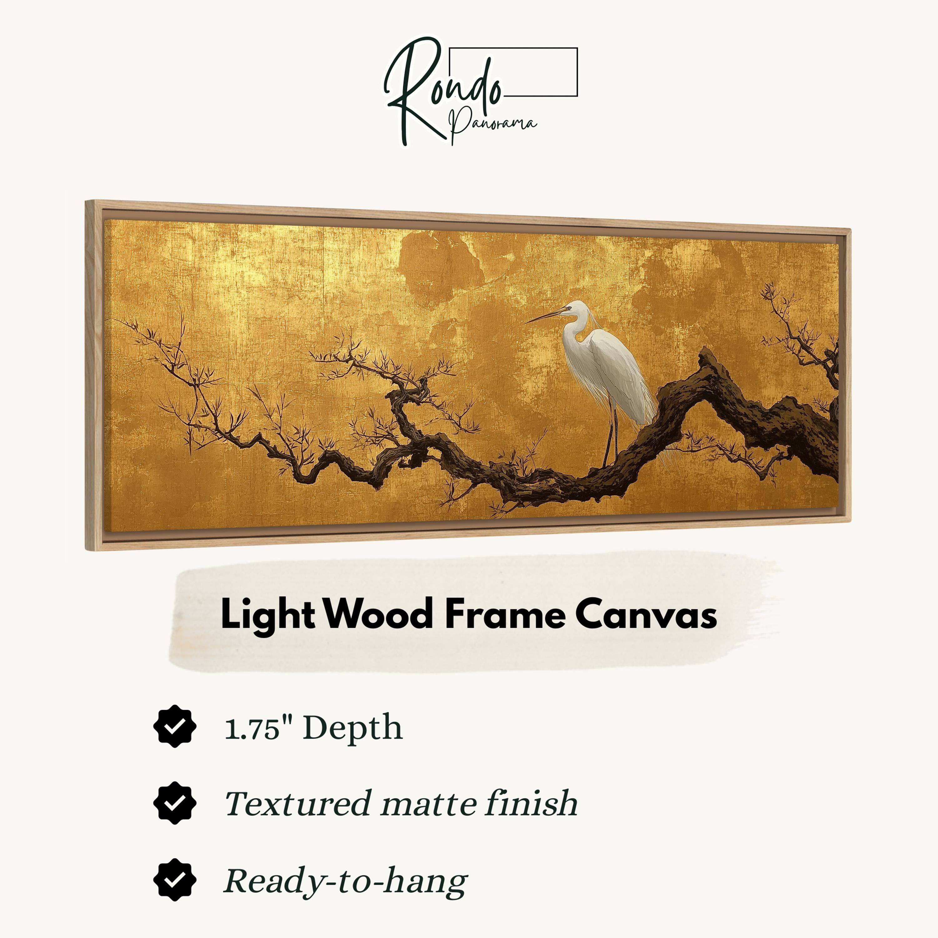 The image is a framed artwork depicting a white egret perched on a branch of a tree with a golden hue.
