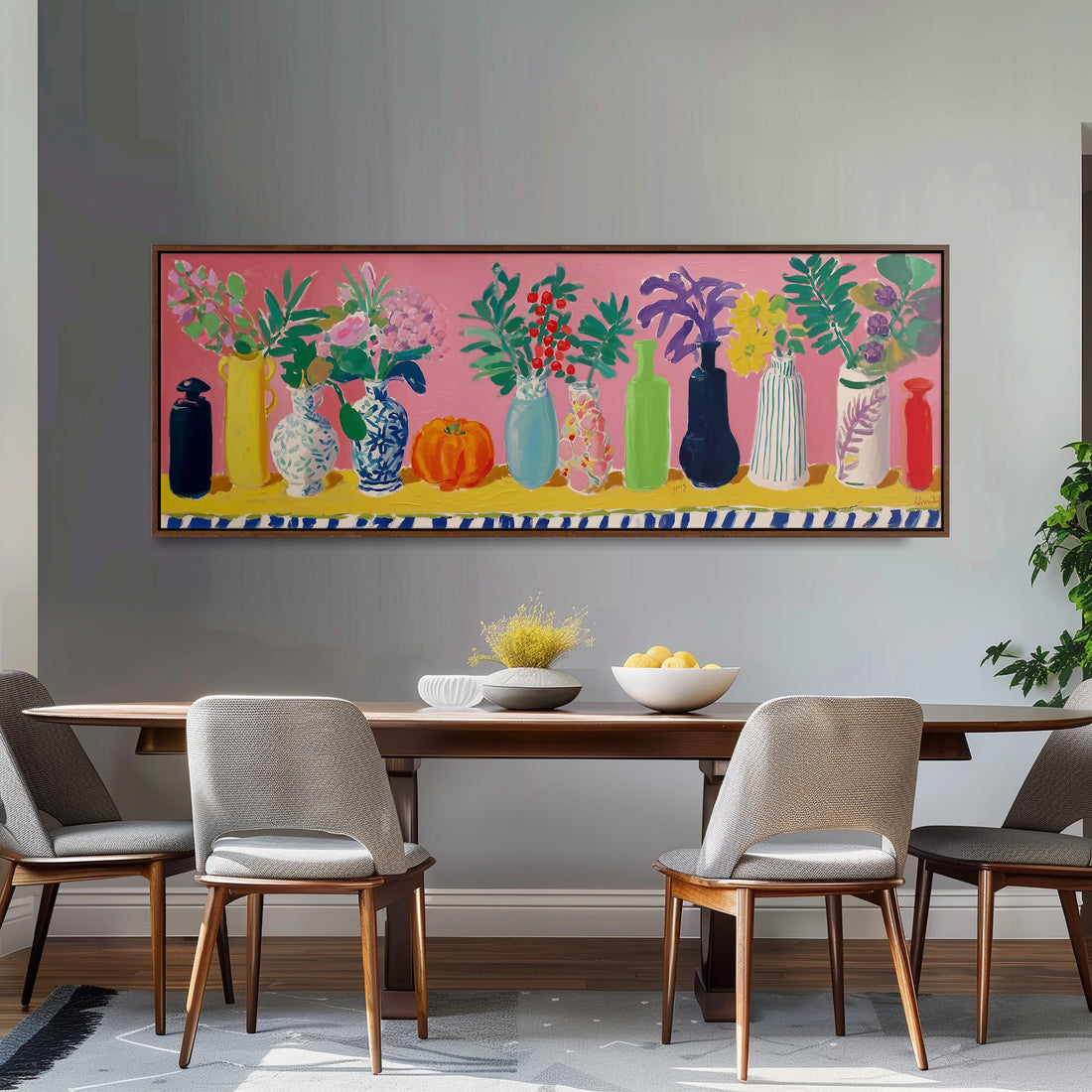 a dining room with a large painting of colorful vases and flowers hanging on the wall above a wooden dining table with four chairs.