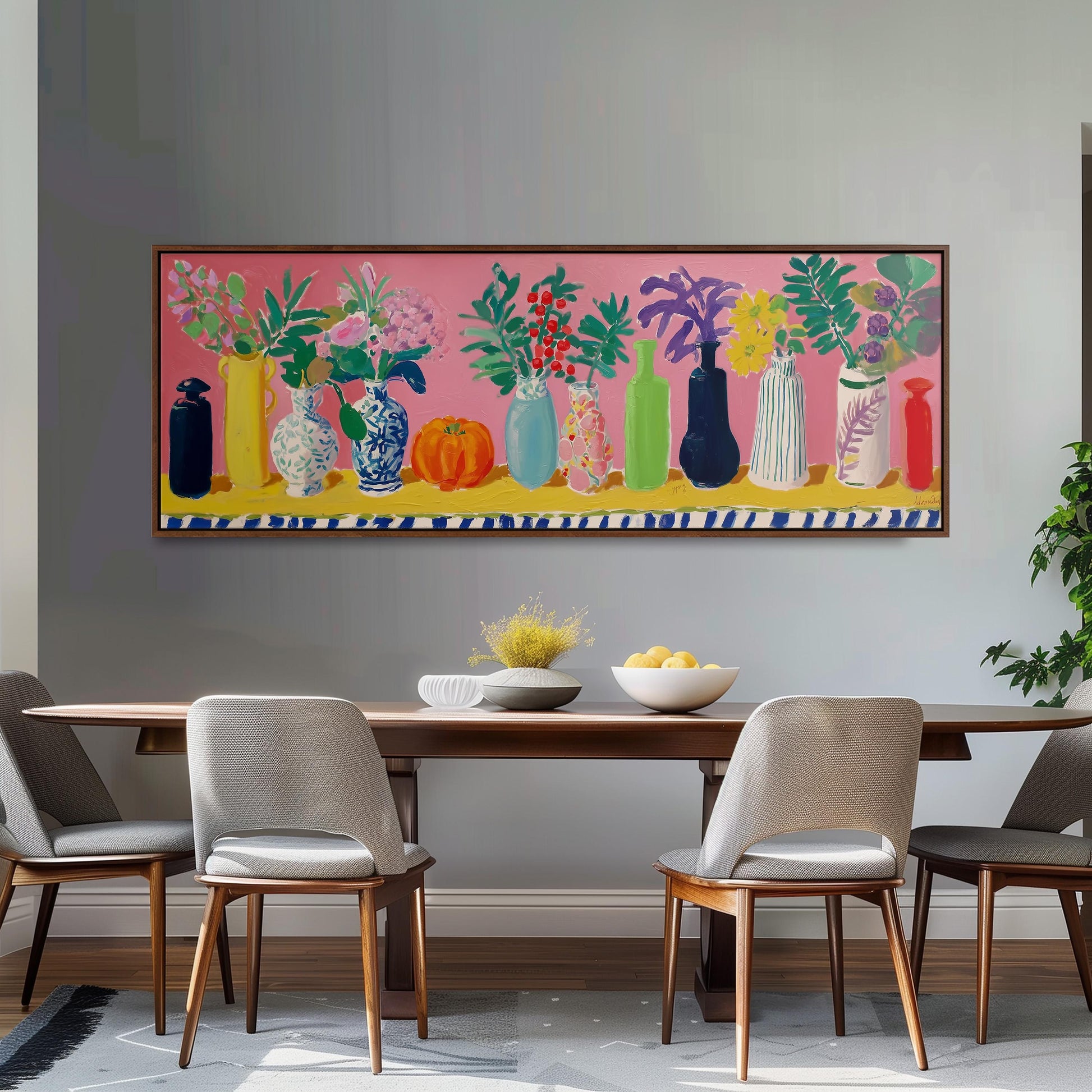 a dining room with a large painting of colorful vases and flowers hanging on the wall above a wooden dining table with four chairs.