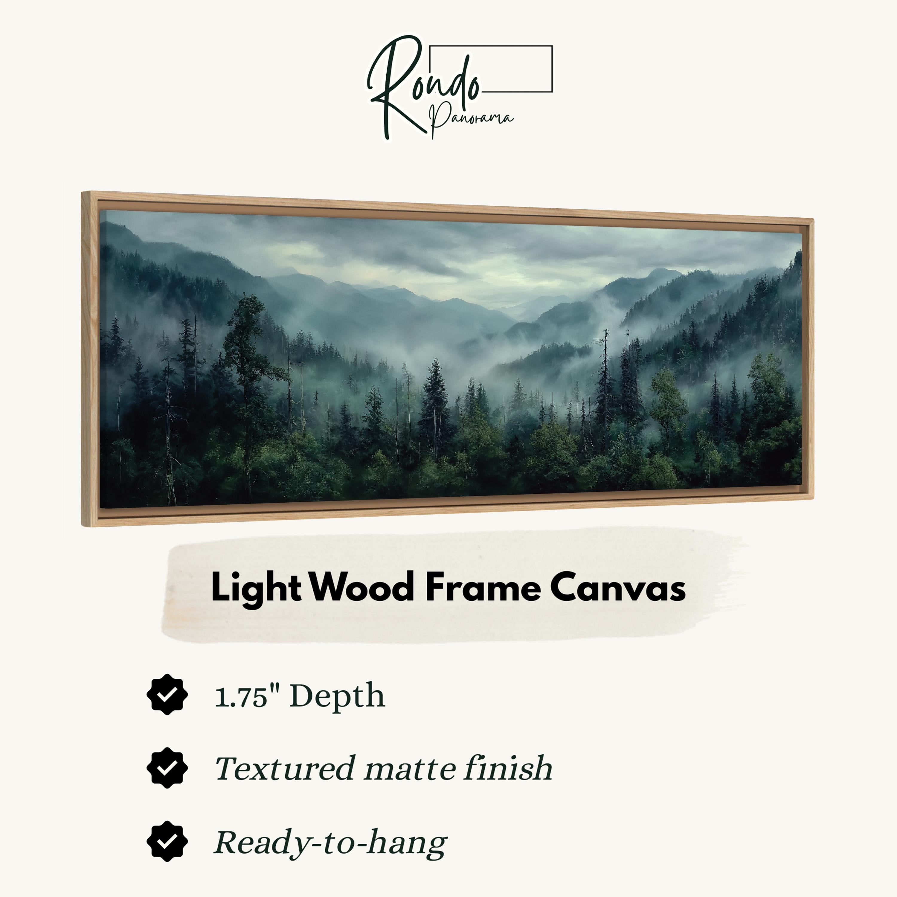 The image is a framed landscape painting depicting a forested mountain range with a misty, hazy atmosphere.