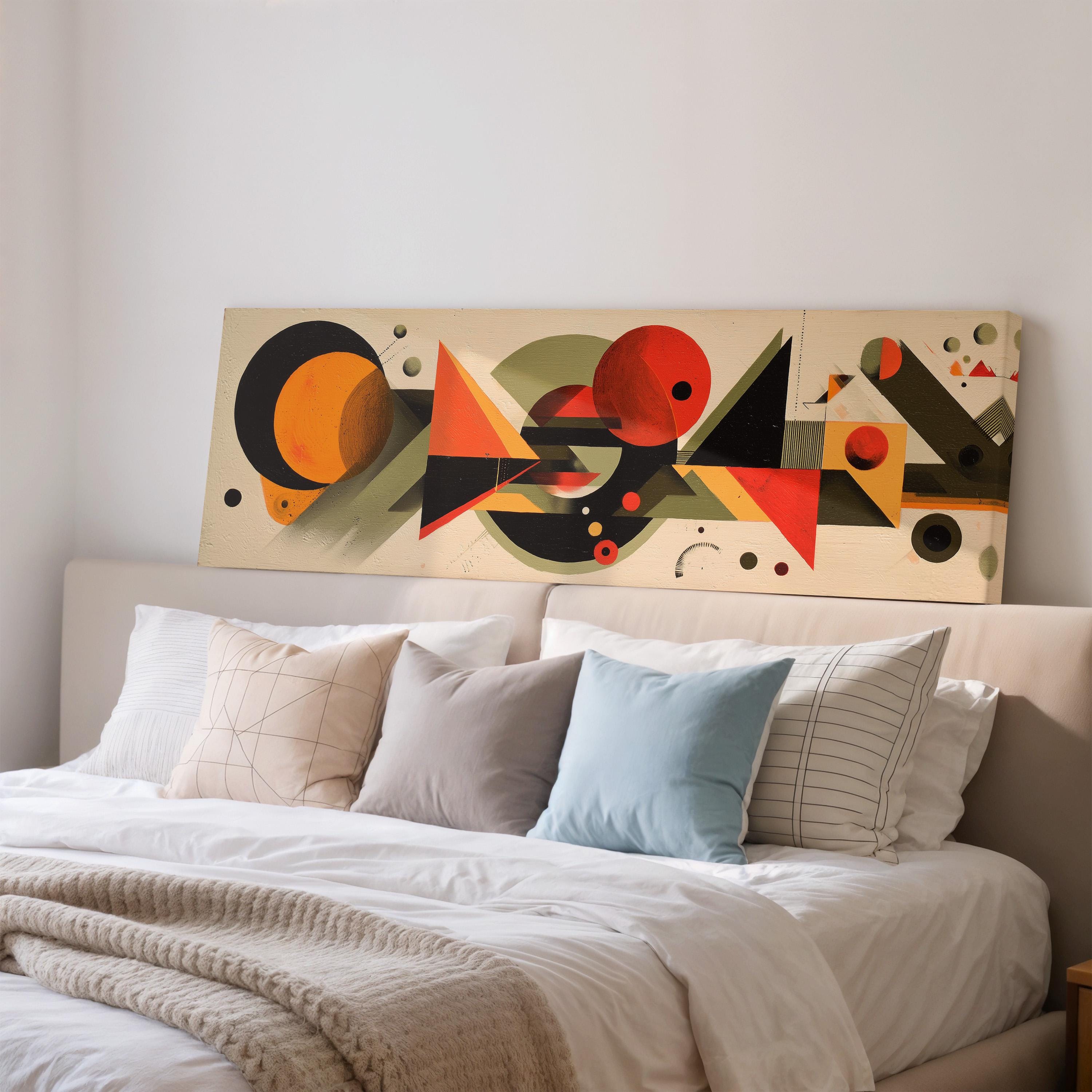 a large abstract painting displayed on a wall above a bed with white bedding and pillows.
