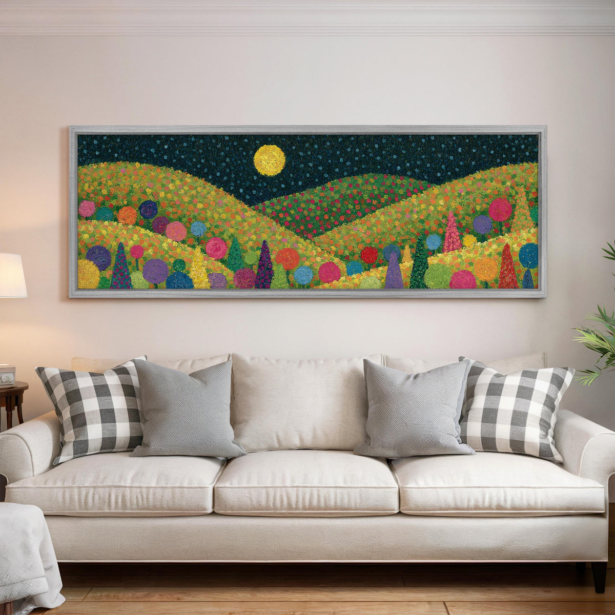 Moonlit pastel flower hills panoramic canvas print above a white sofa in a bright living room