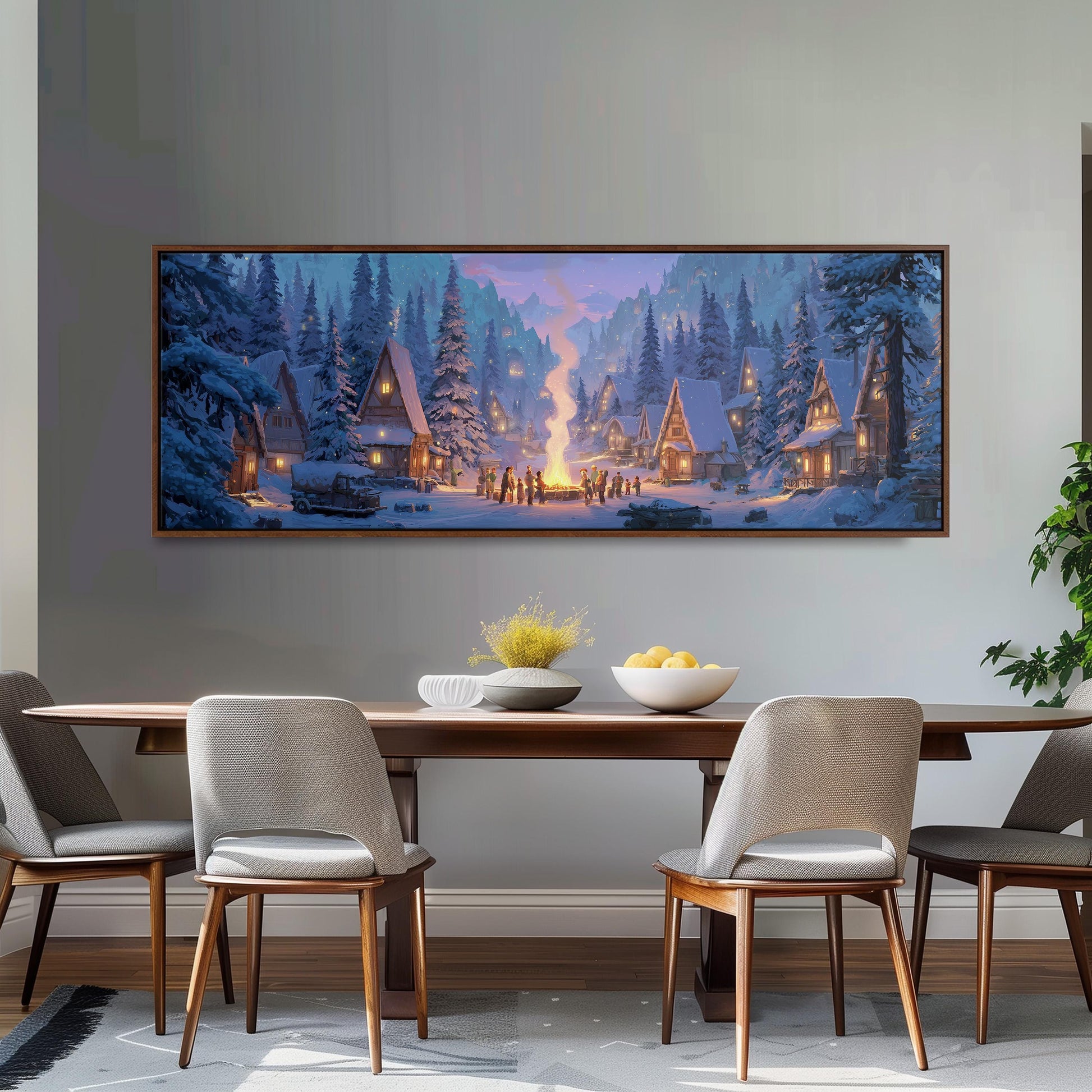 a large, framed painting of a snowy village scene hanging on a wall above a wooden dining table with four chairs.