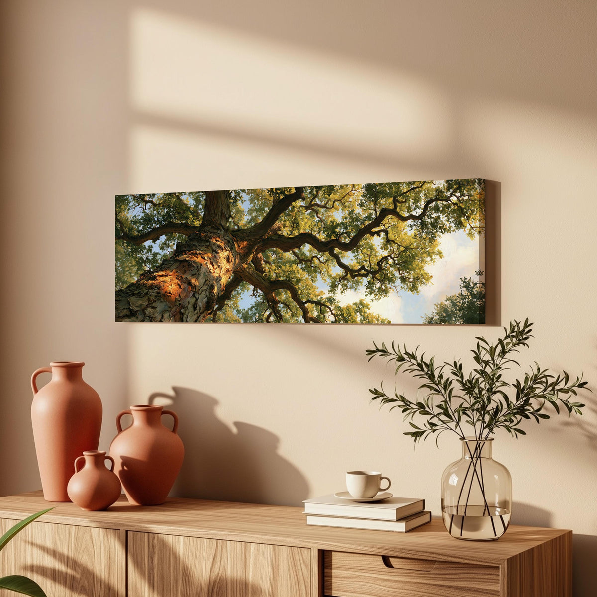 Twisting oak branch from below long horizontal canvas print displayed on a wall